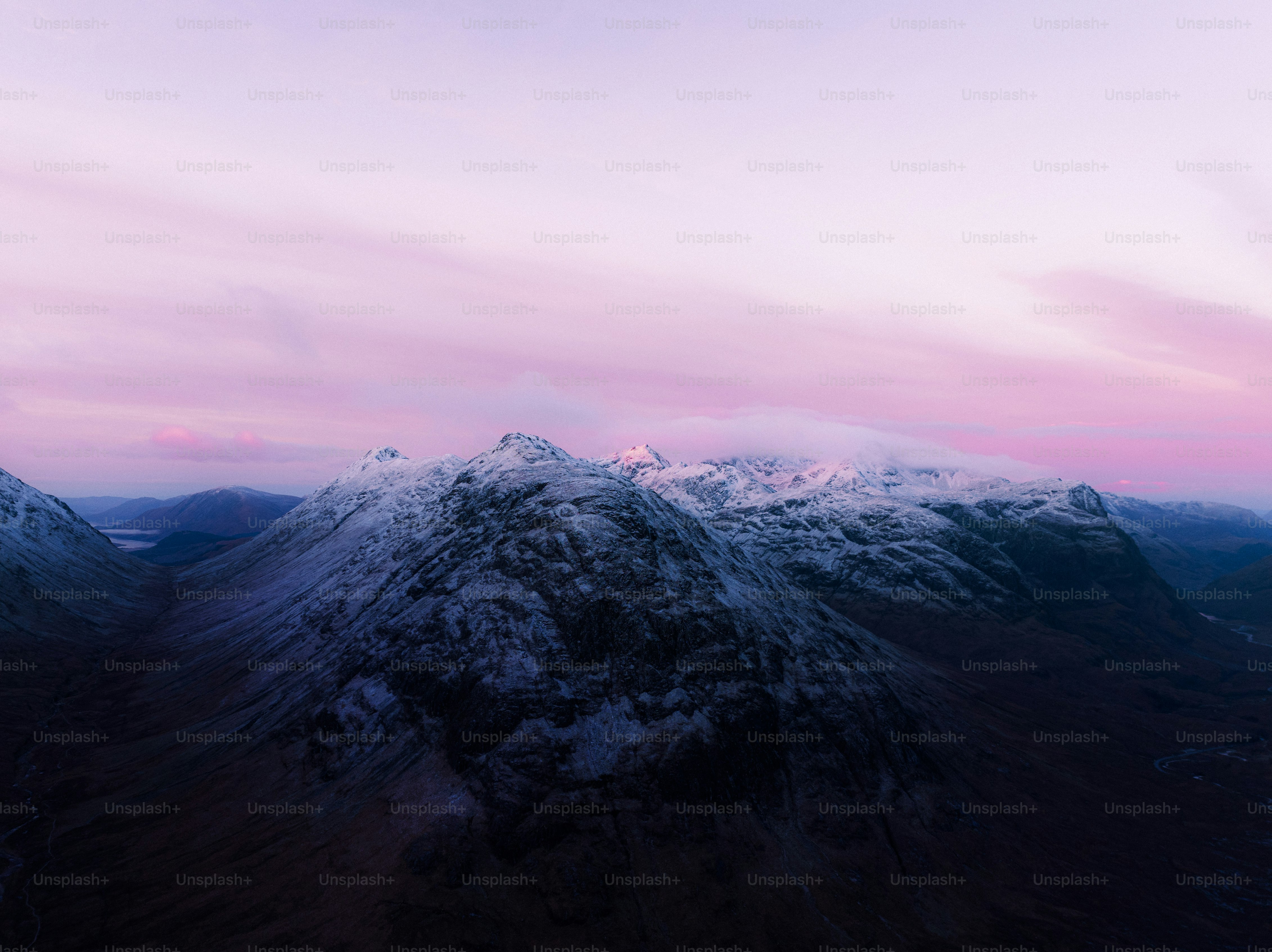 An aerial view of a snowy mountain range