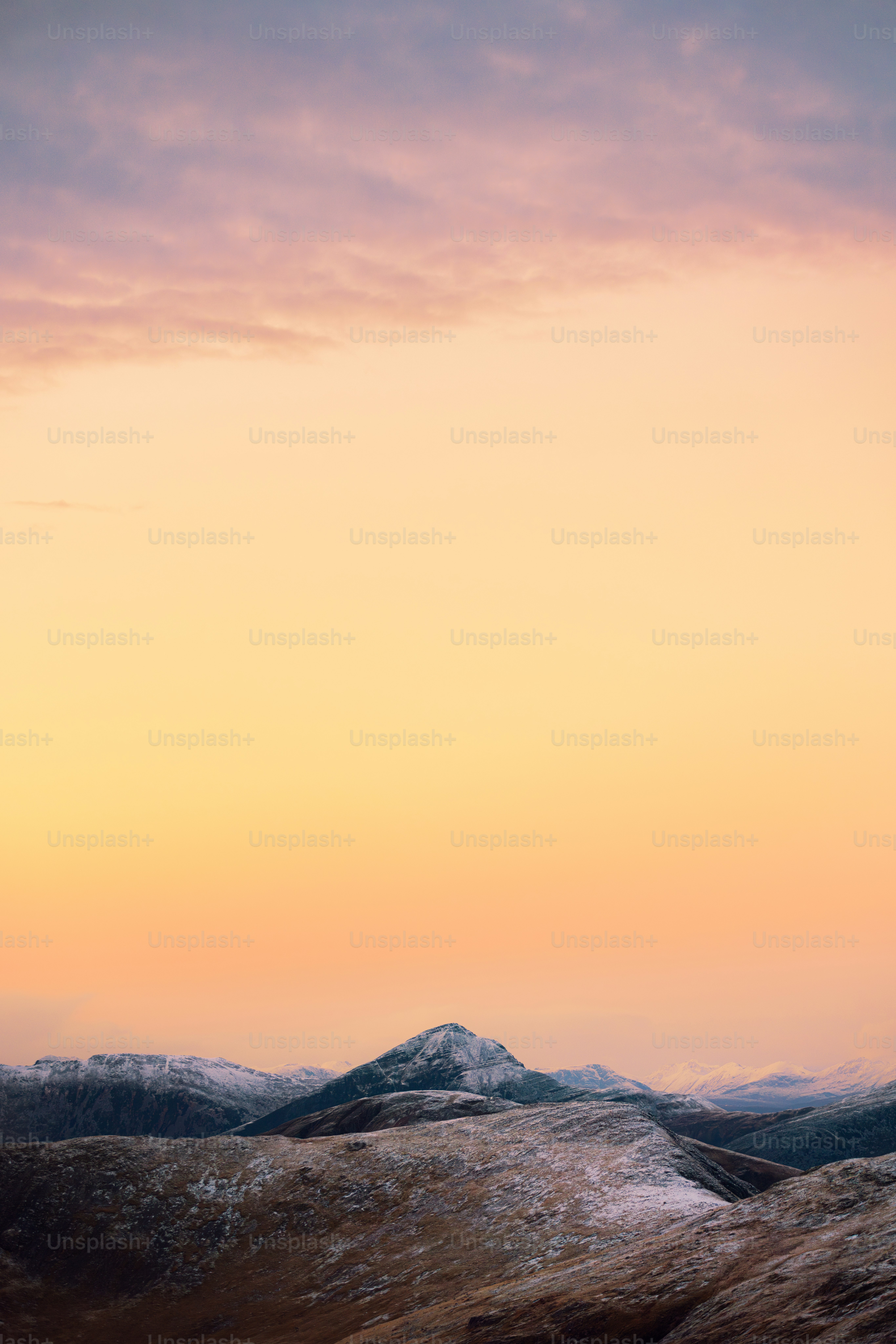 A person standing on top of a snow covered hill