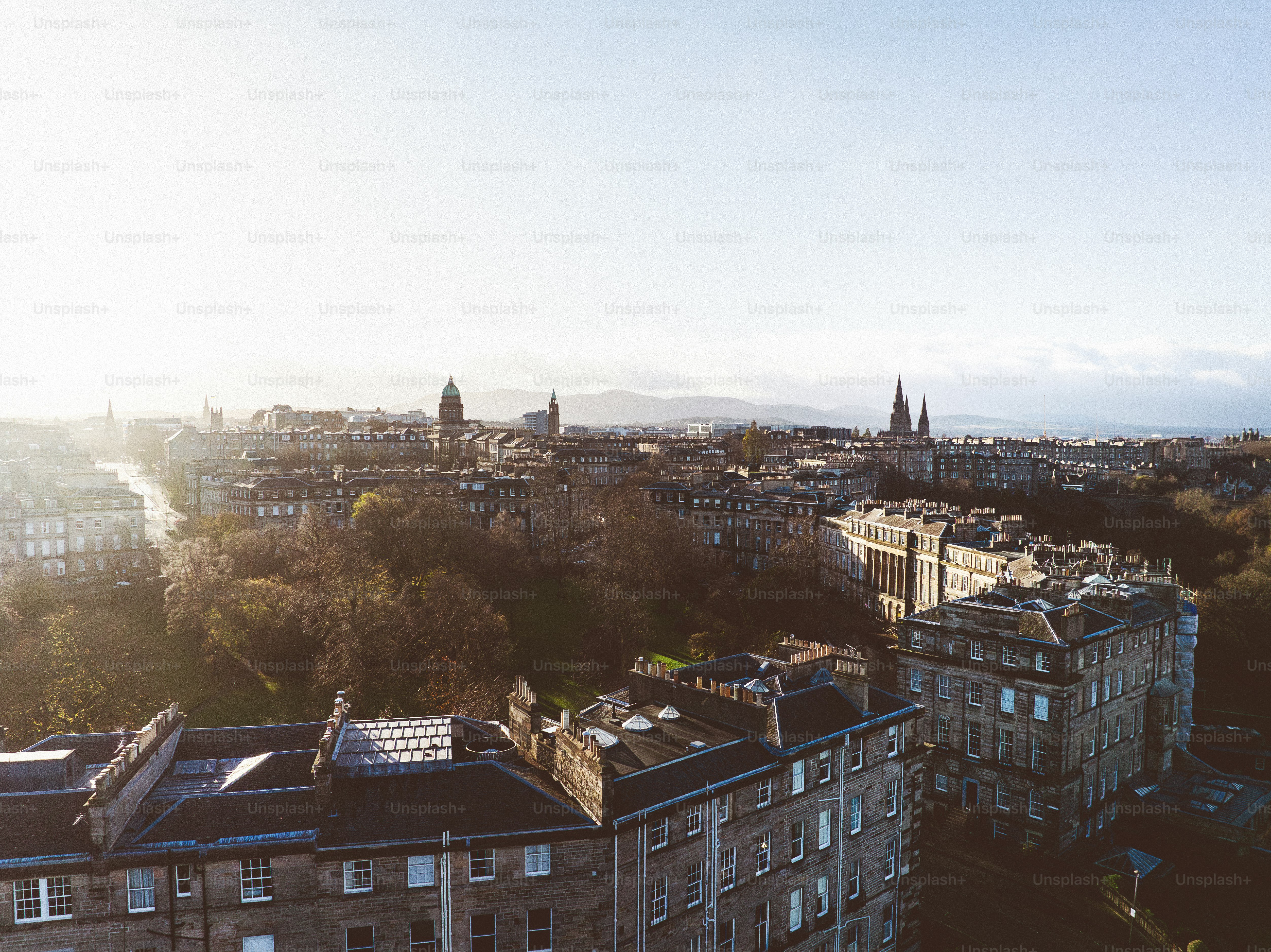An aerial view of a city with tall buildings