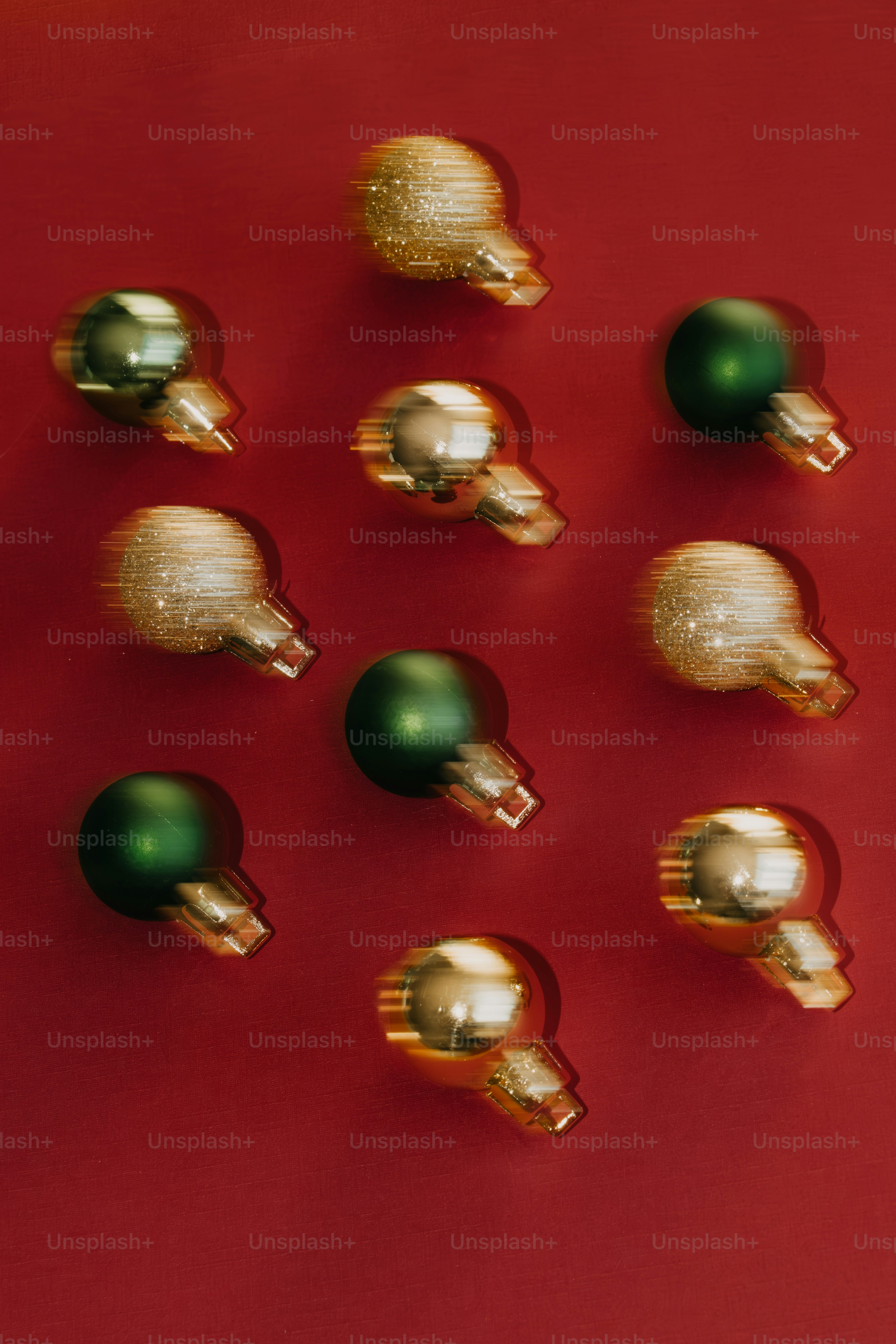 A group of christmas ornaments sitting on top of a red surface