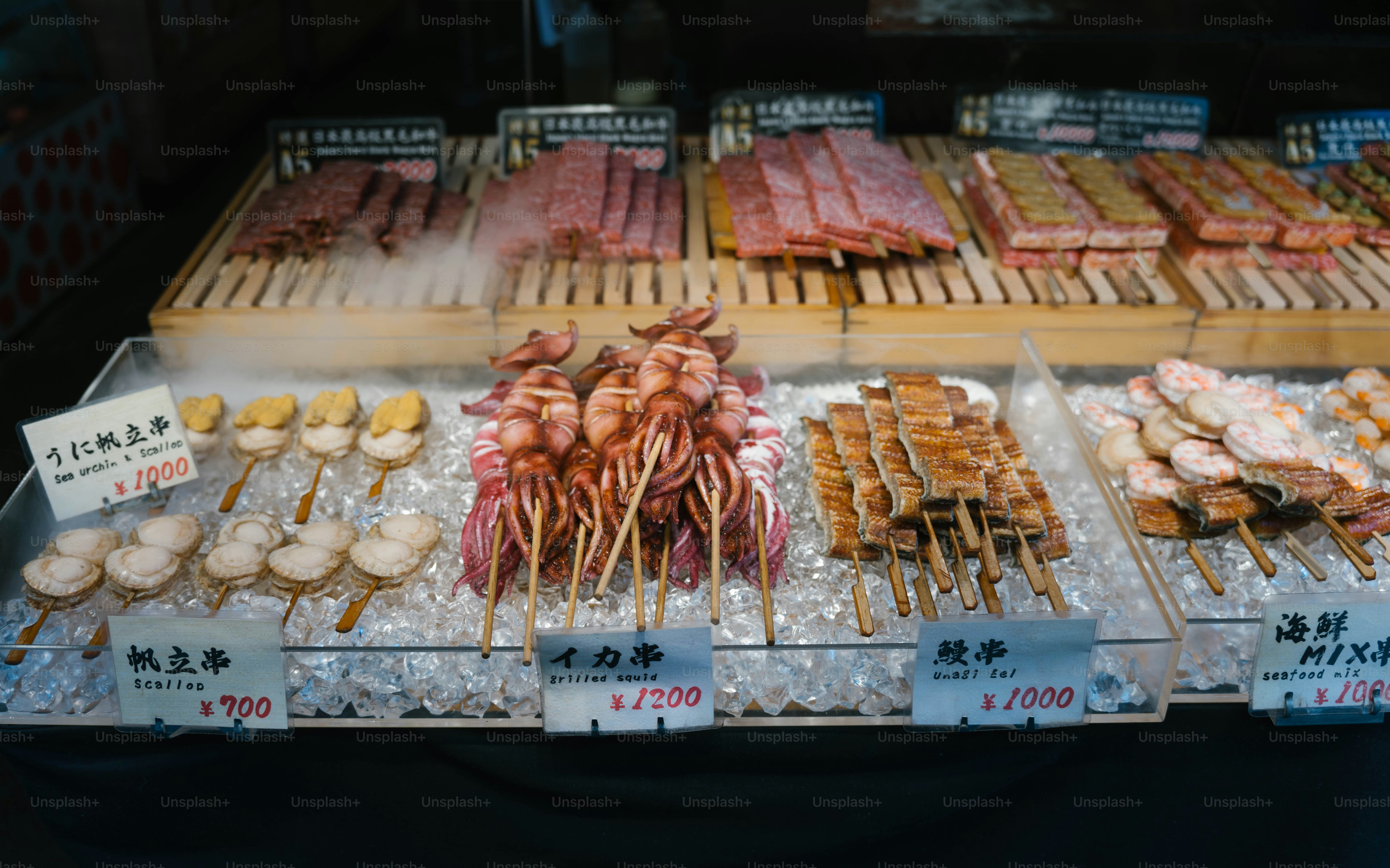 A display case filled with lots of different types of food