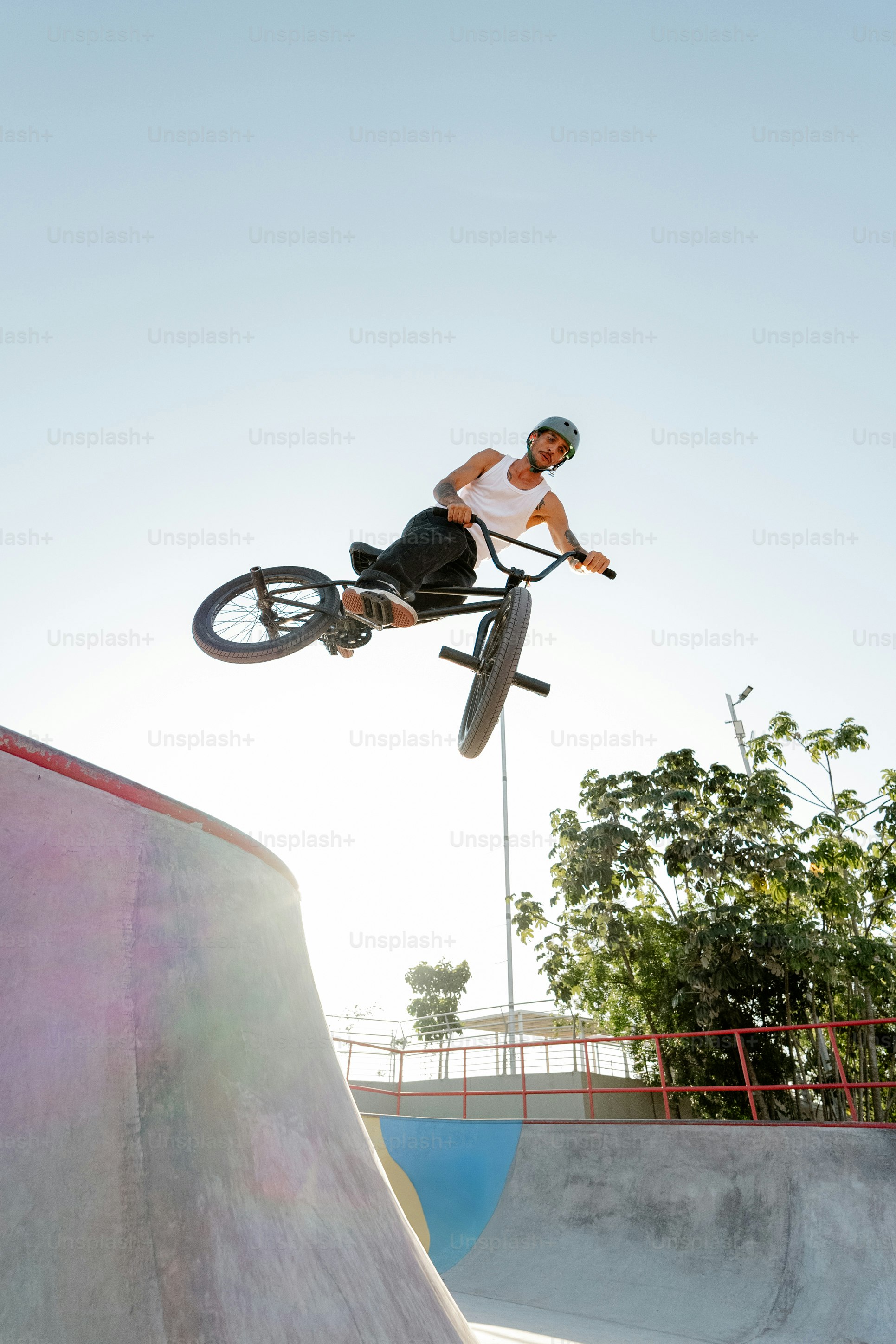 A man flying through the air while riding a bike