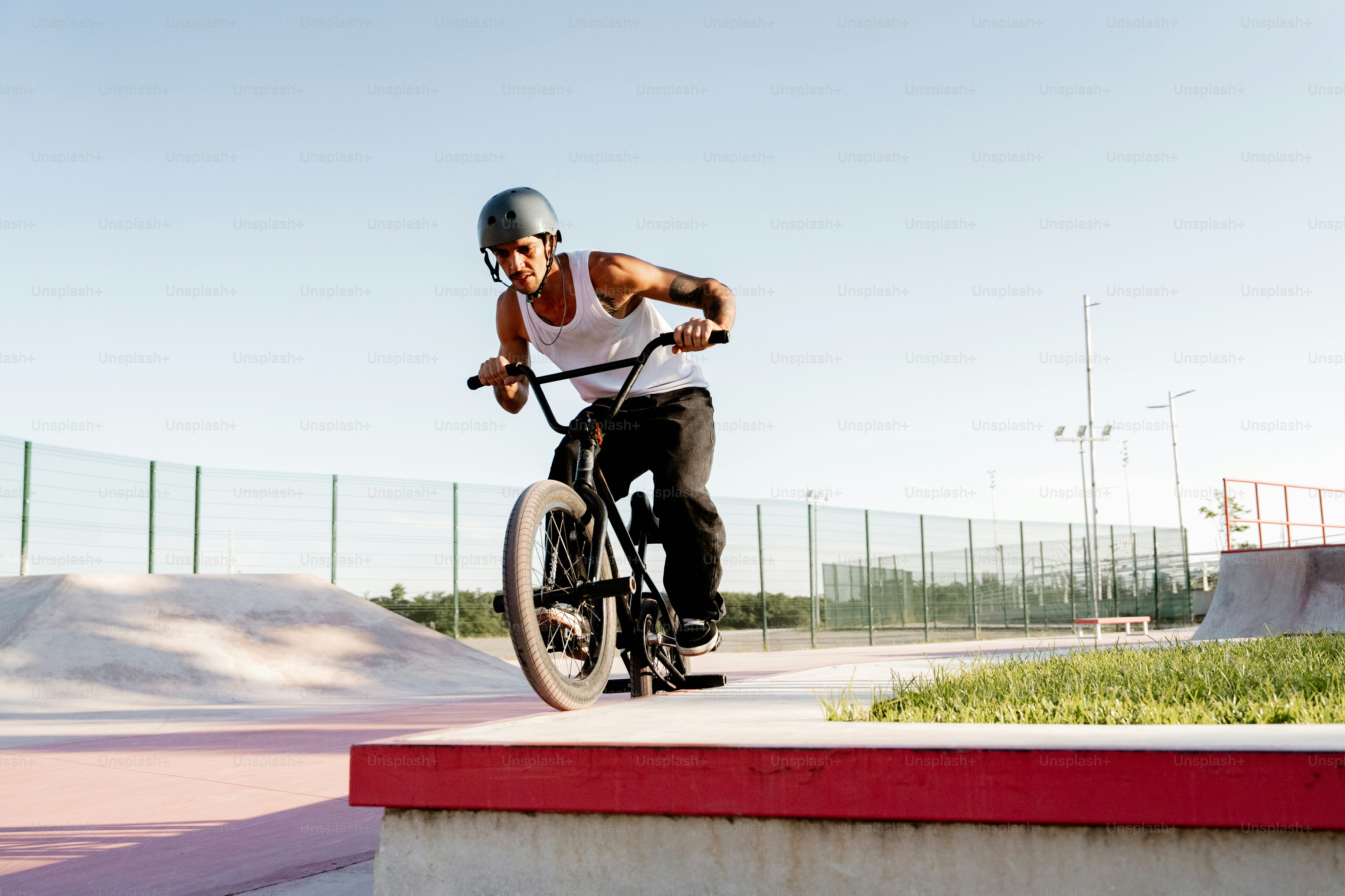 A man riding a bike on top of a ramp photo – Man Image on Unsplash