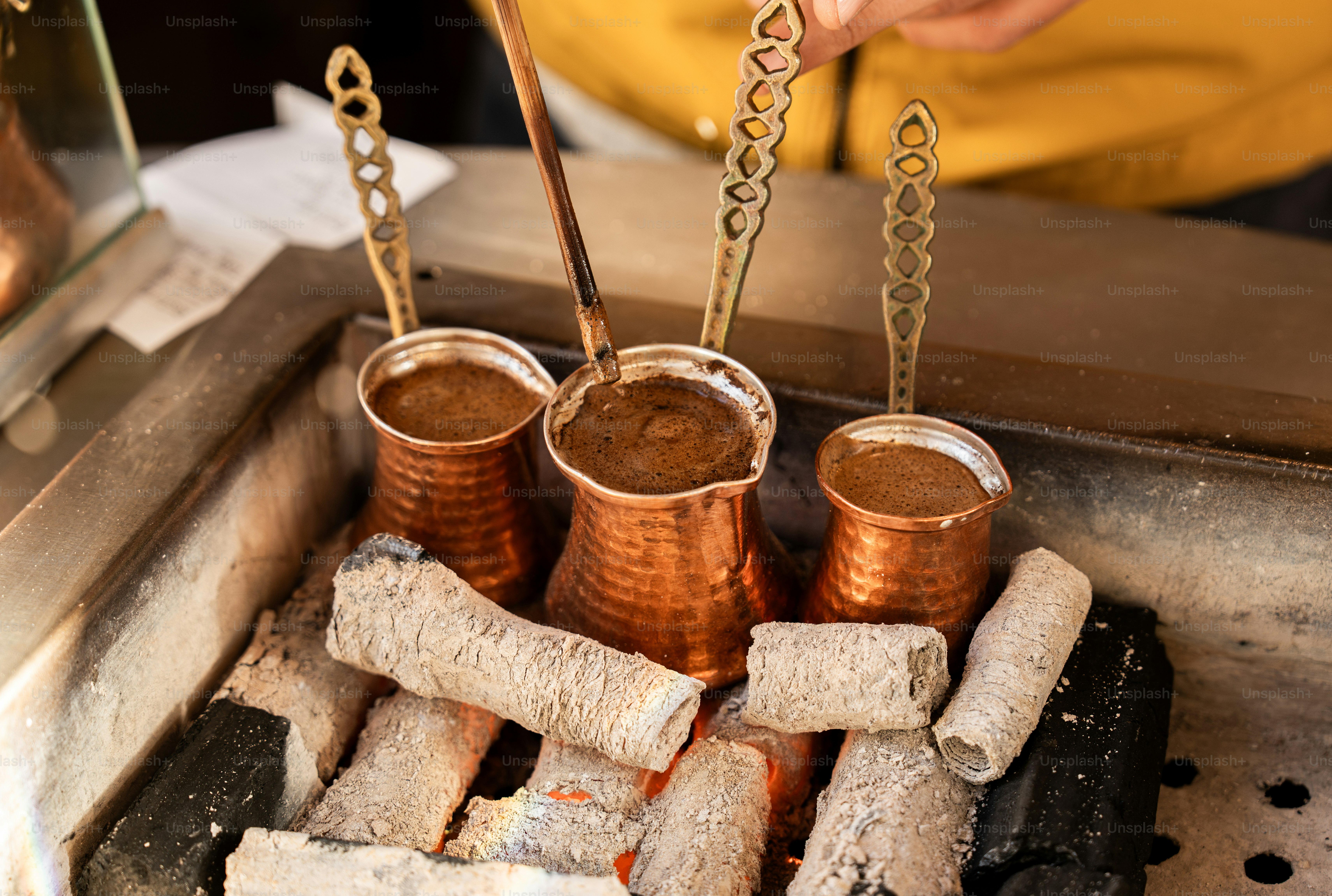 A person is cooking some food on a grill