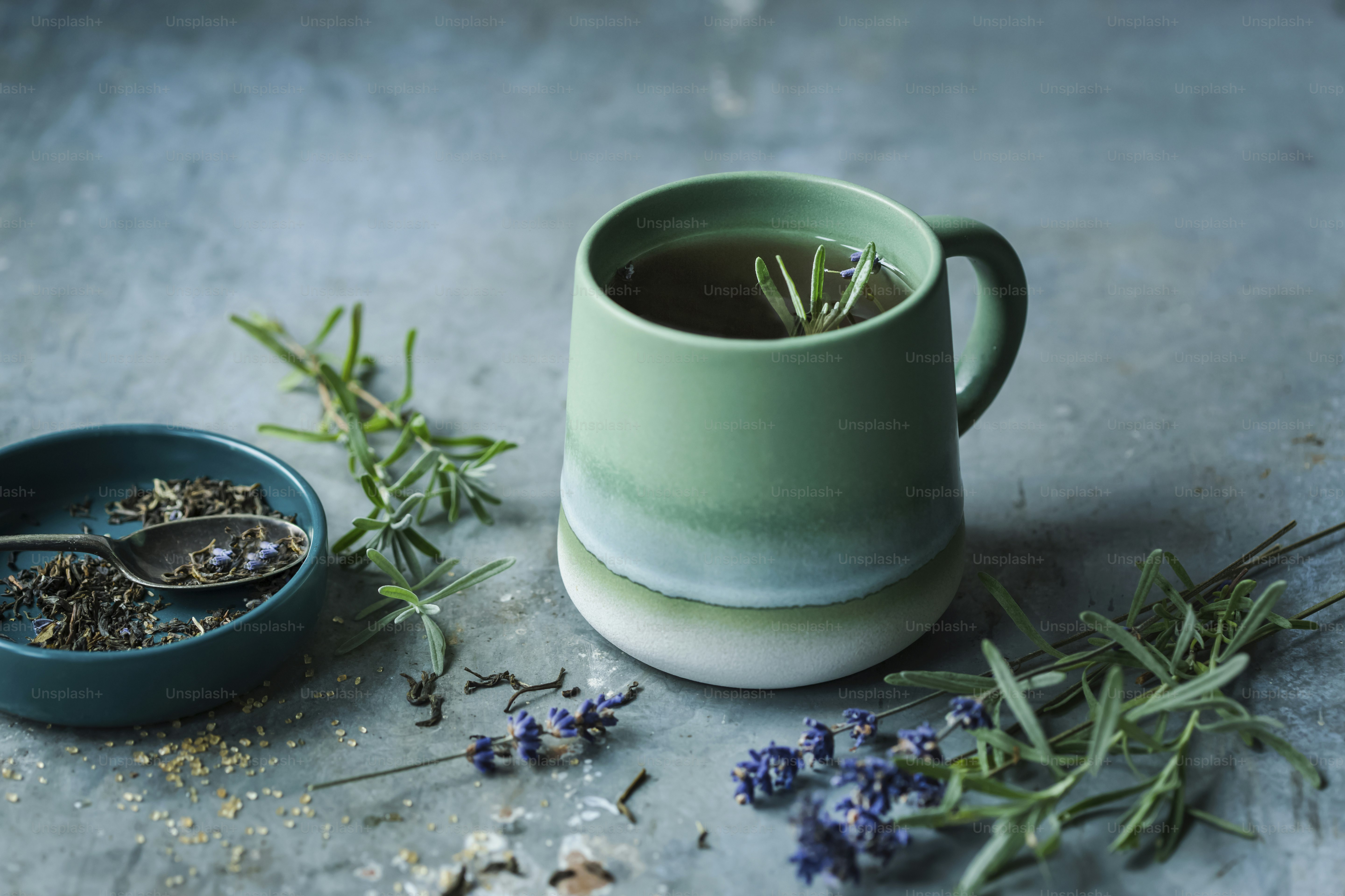 A cup of tea next to a bowl of lavender