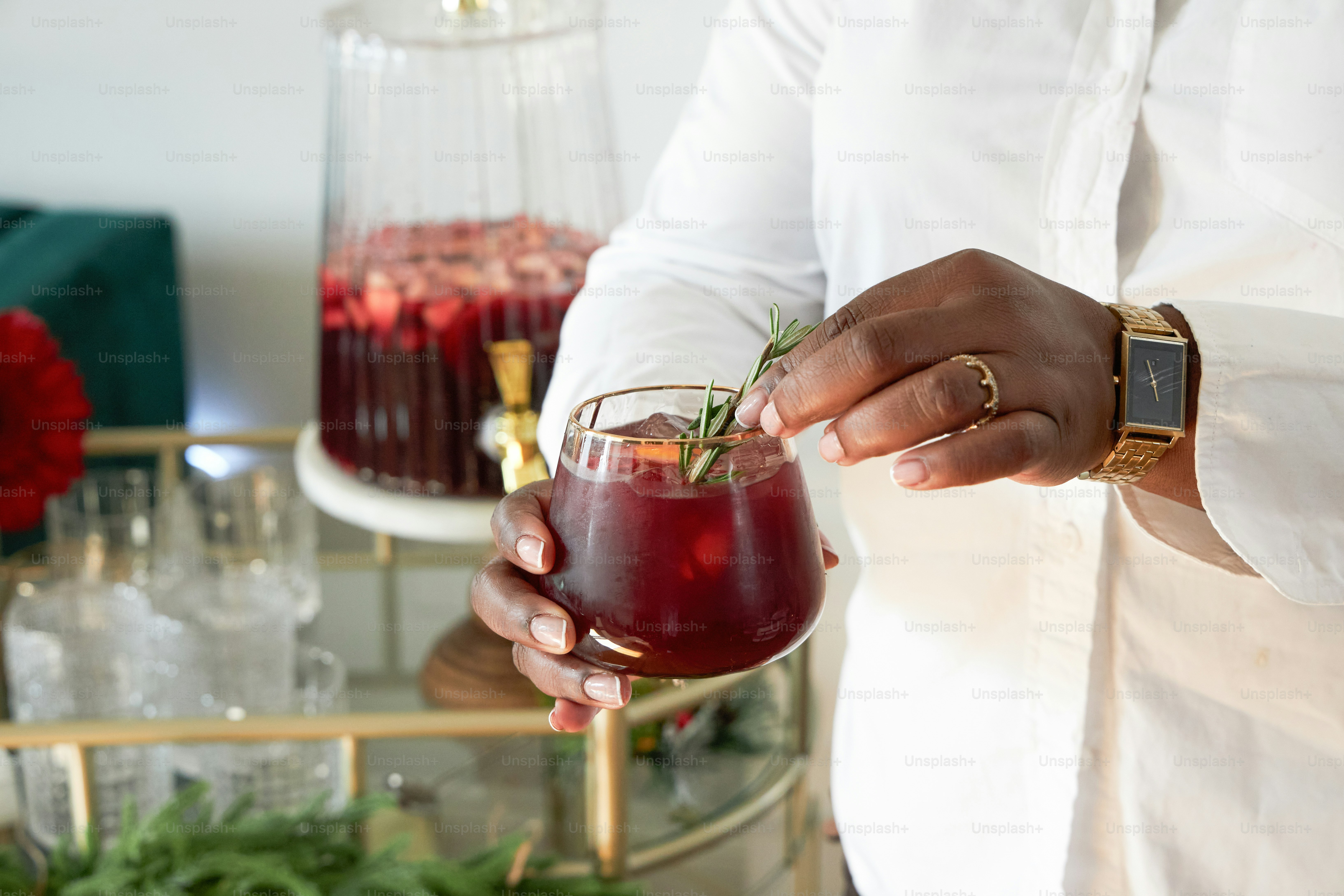 A person holding a drink in their hand