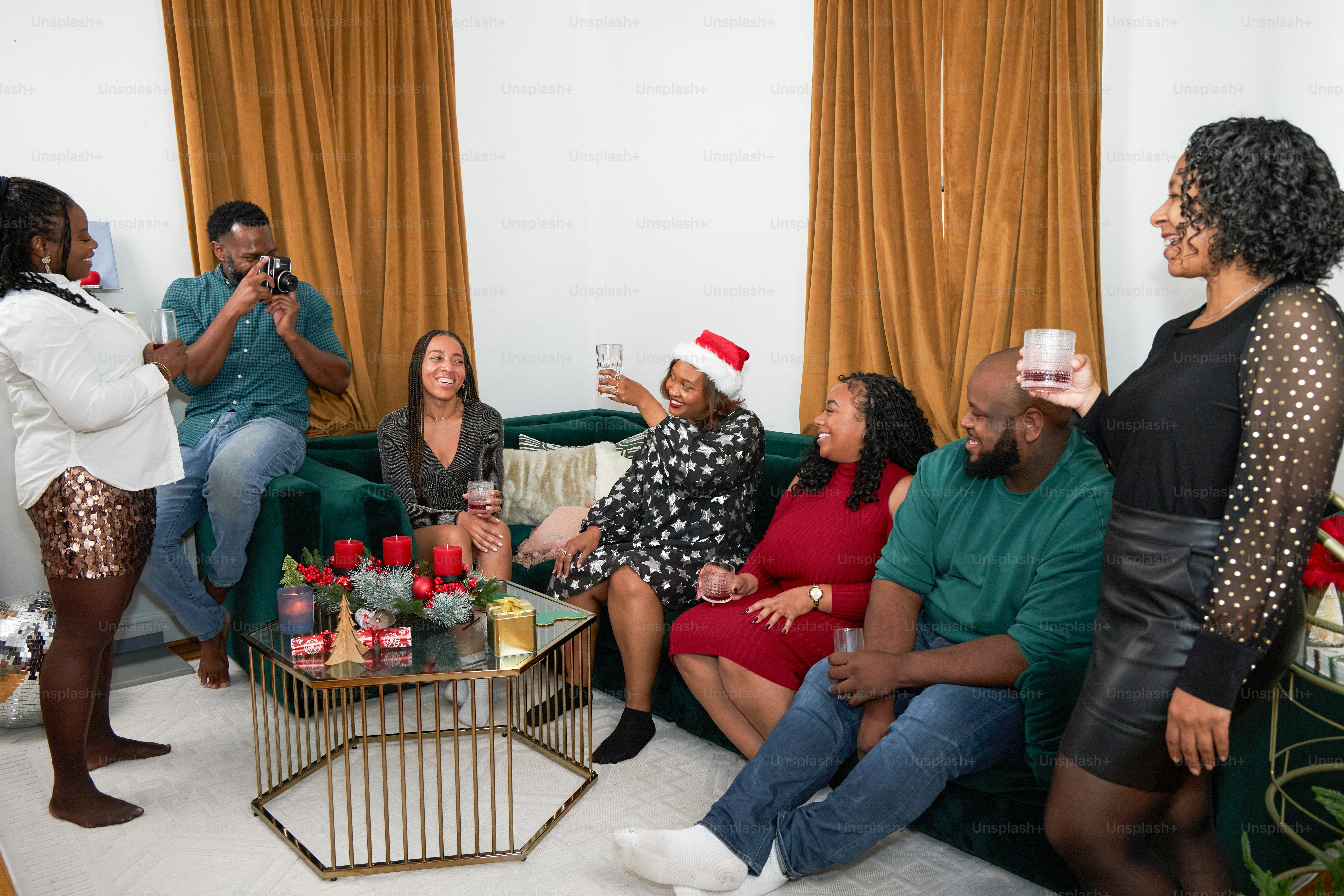A group of people sitting around a living room together