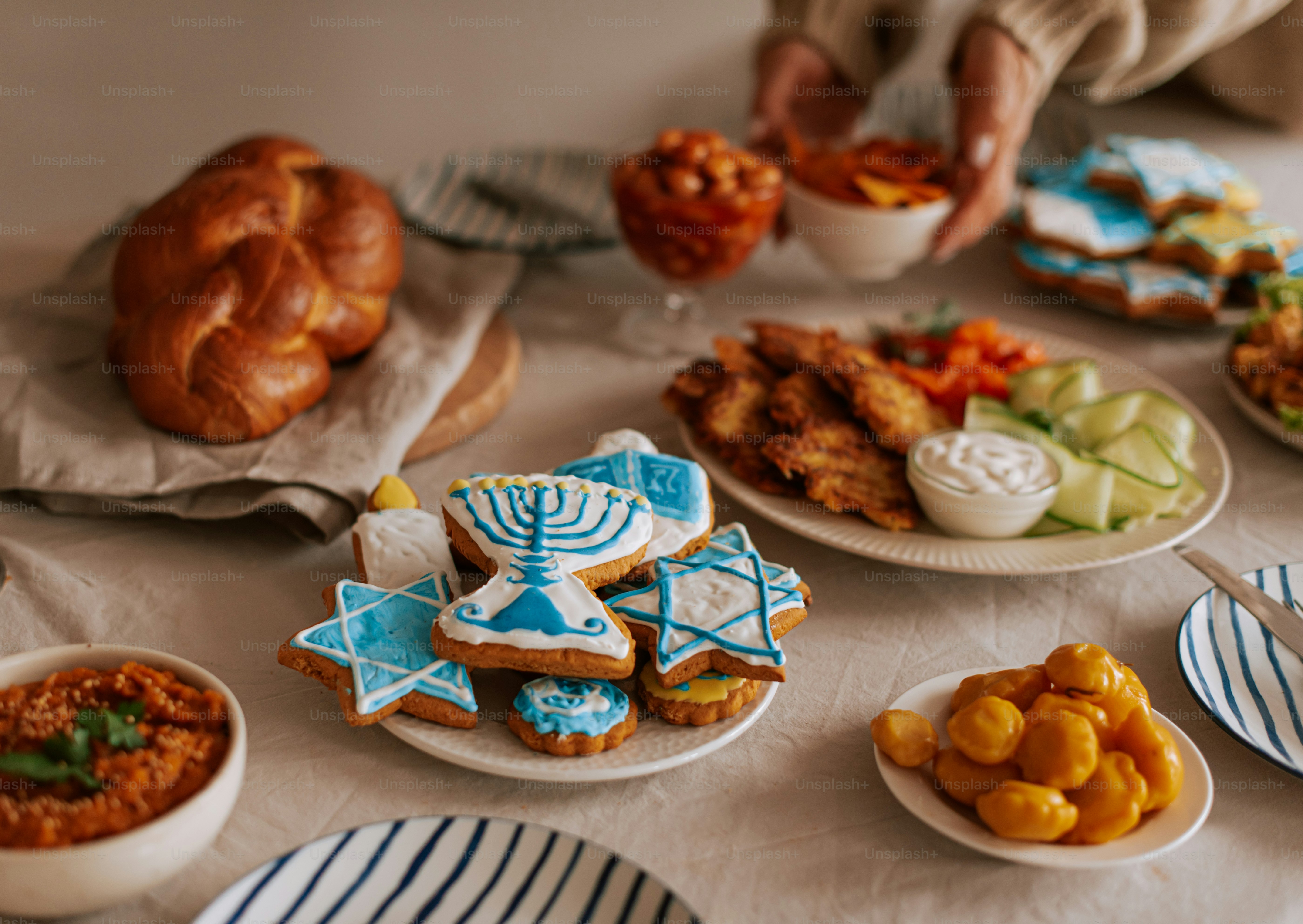 A table topped with lots of plates of food