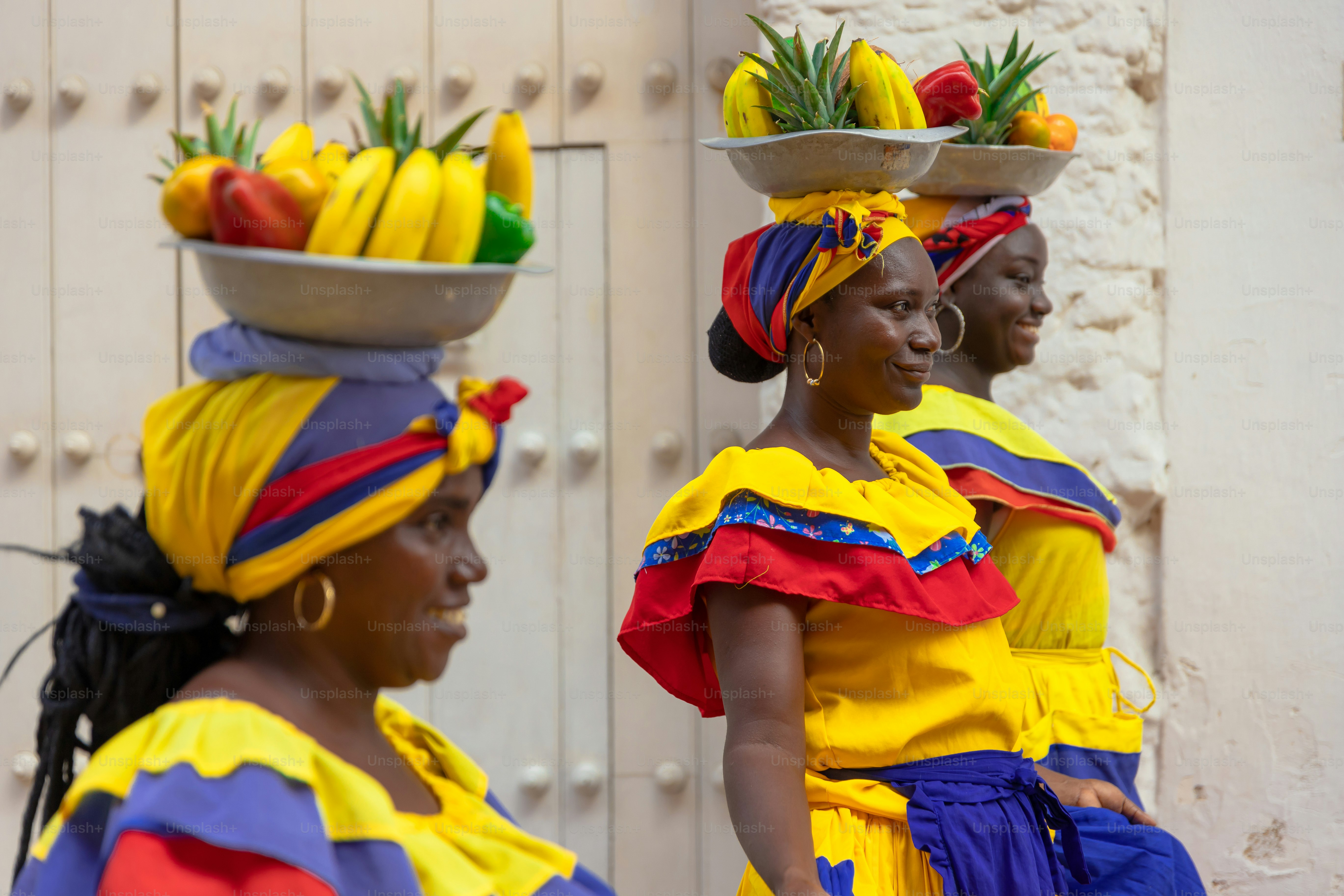 A group of women with baskets of fruit on their heads photo – Travel ...