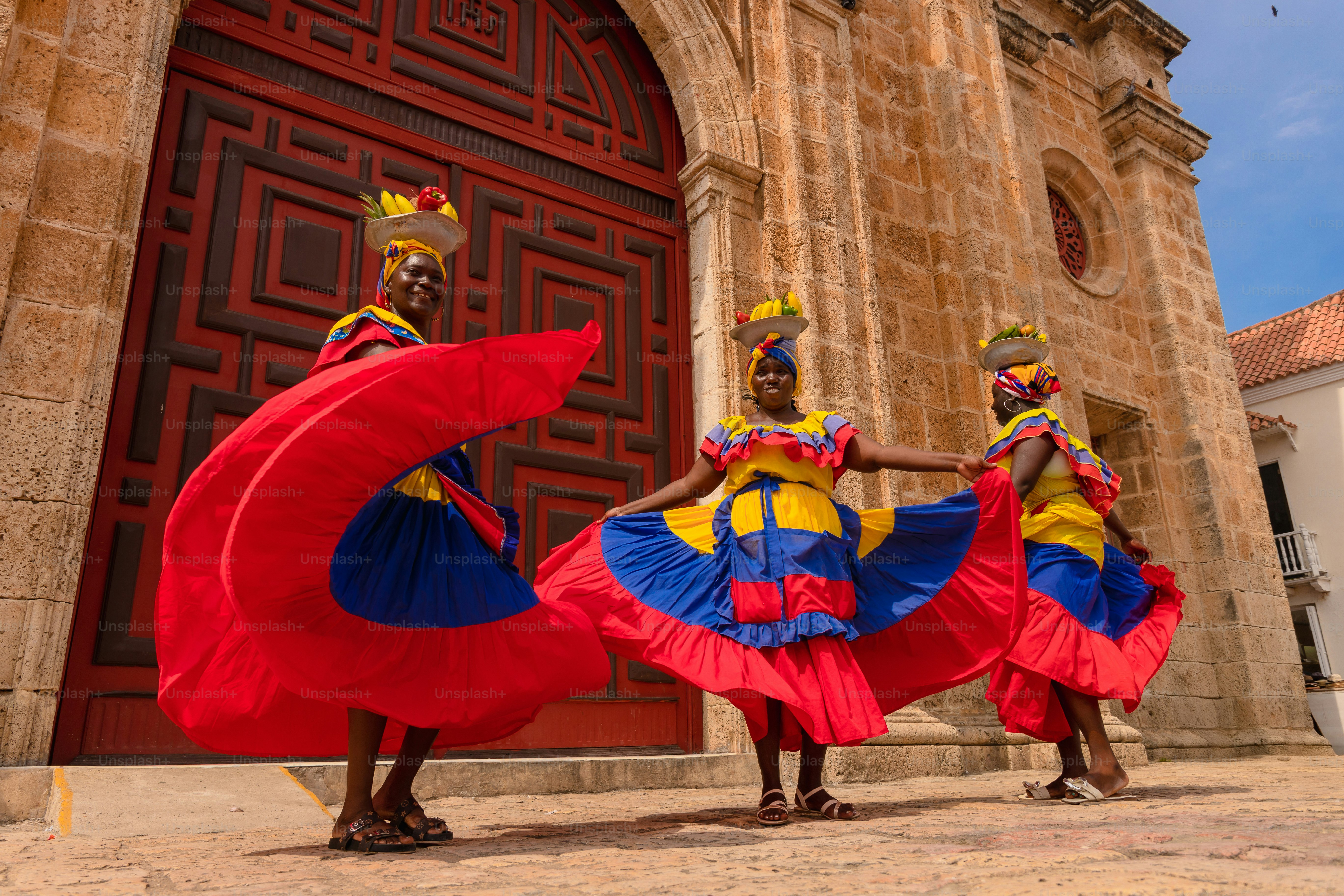 A group of people that are standing in front of a building