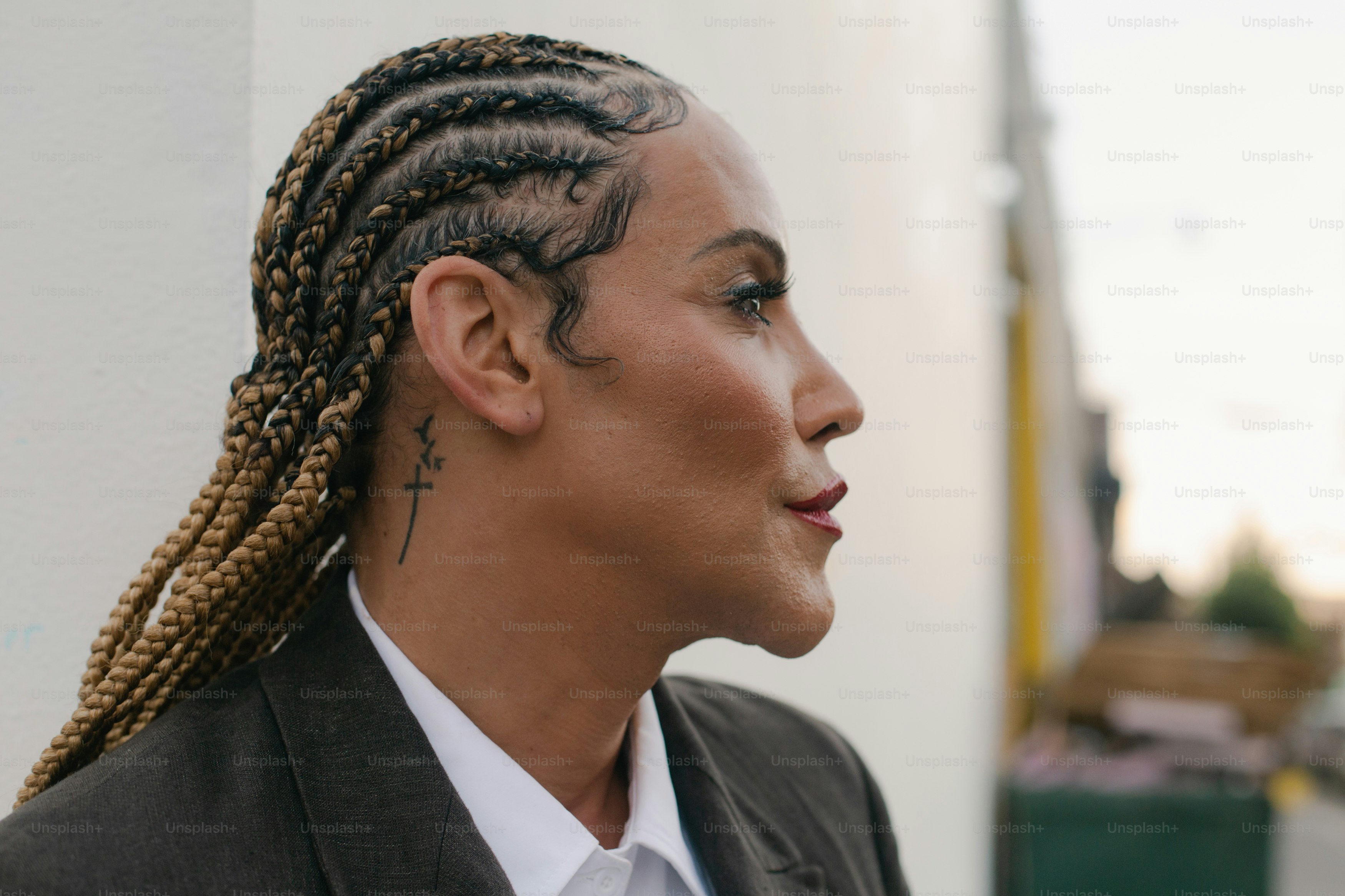 A woman with dreadlocks and a white shirt