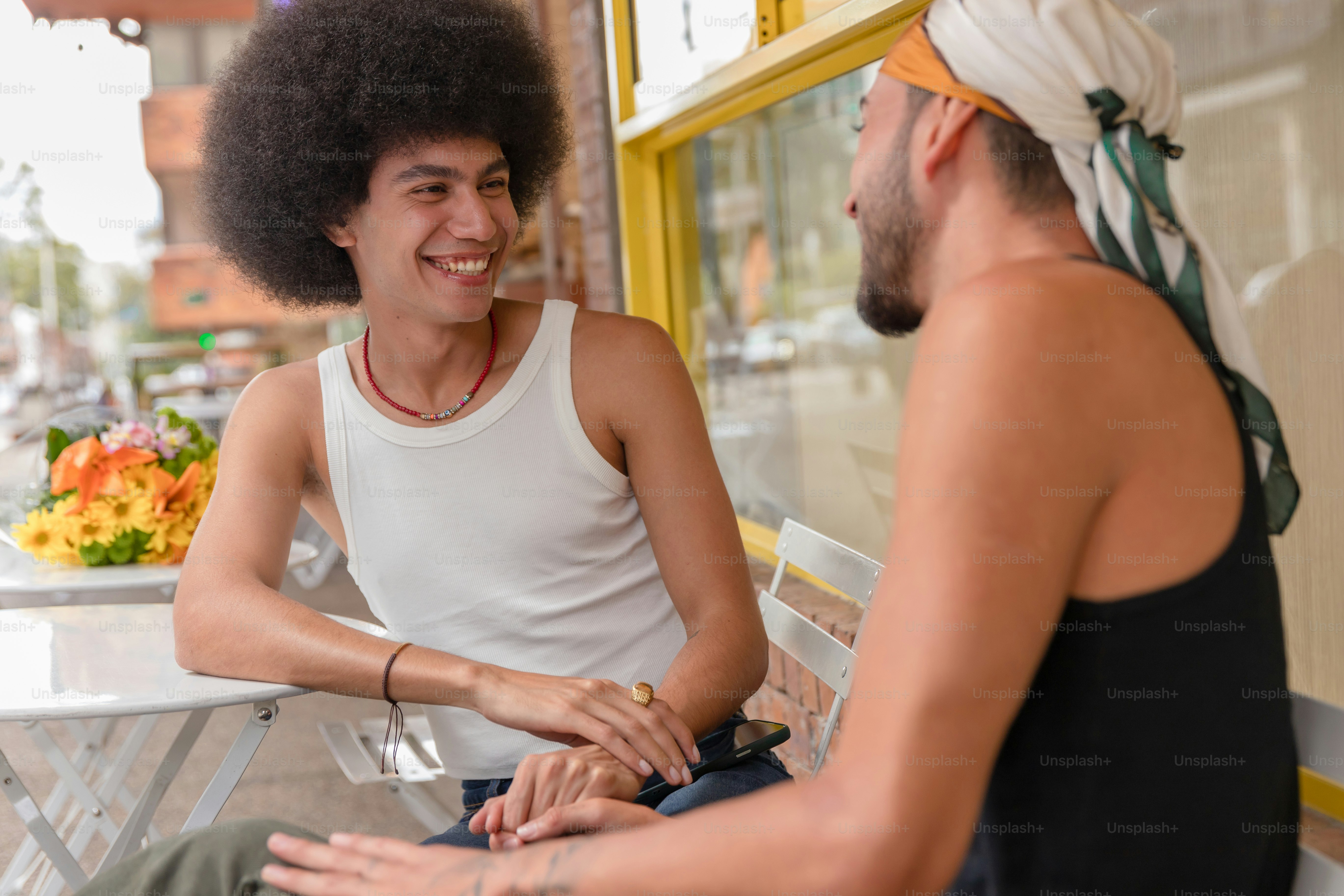 A man sitting next to a woman on a bench