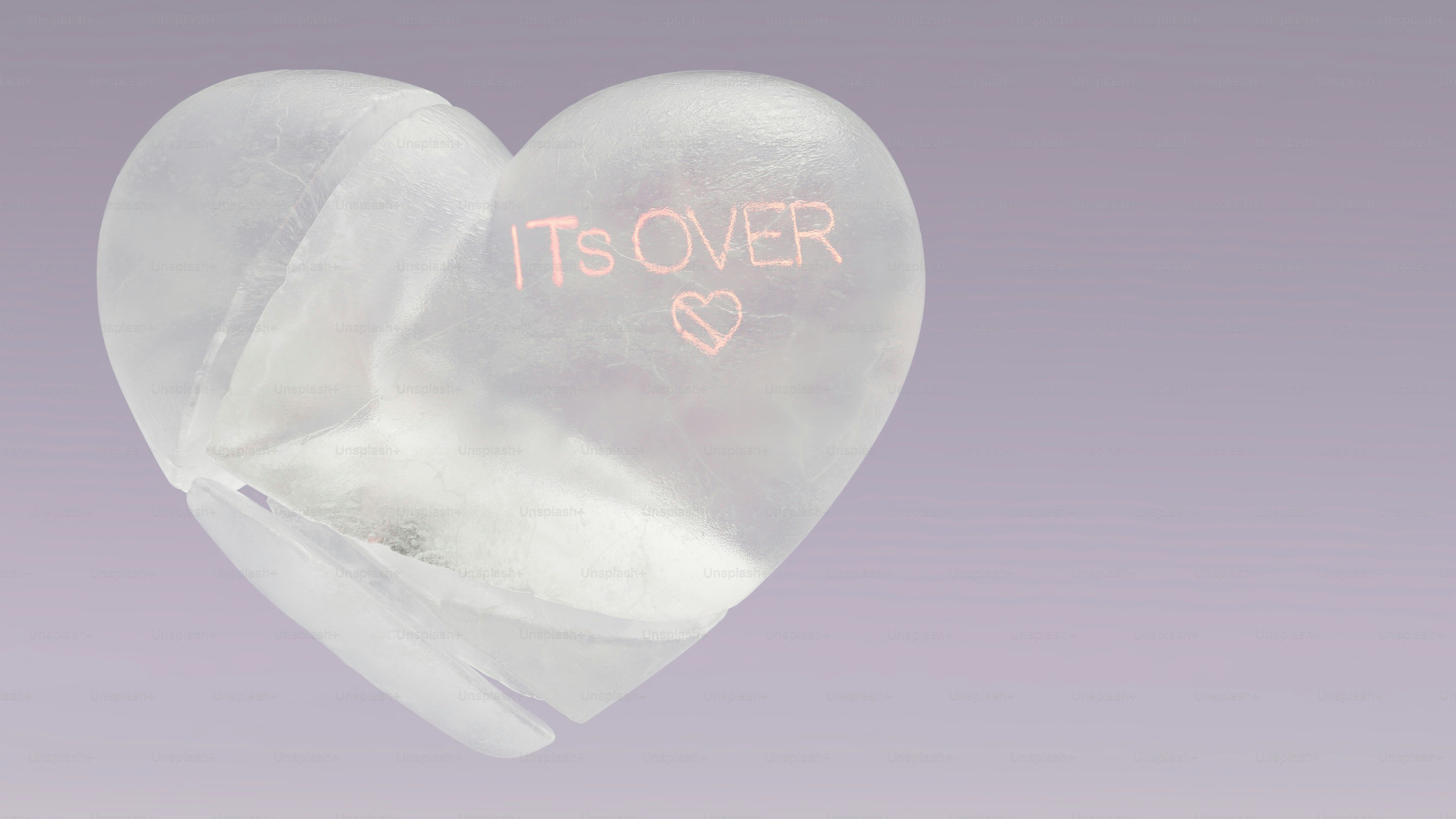 A clear heart shaped object with the word it's over written on it