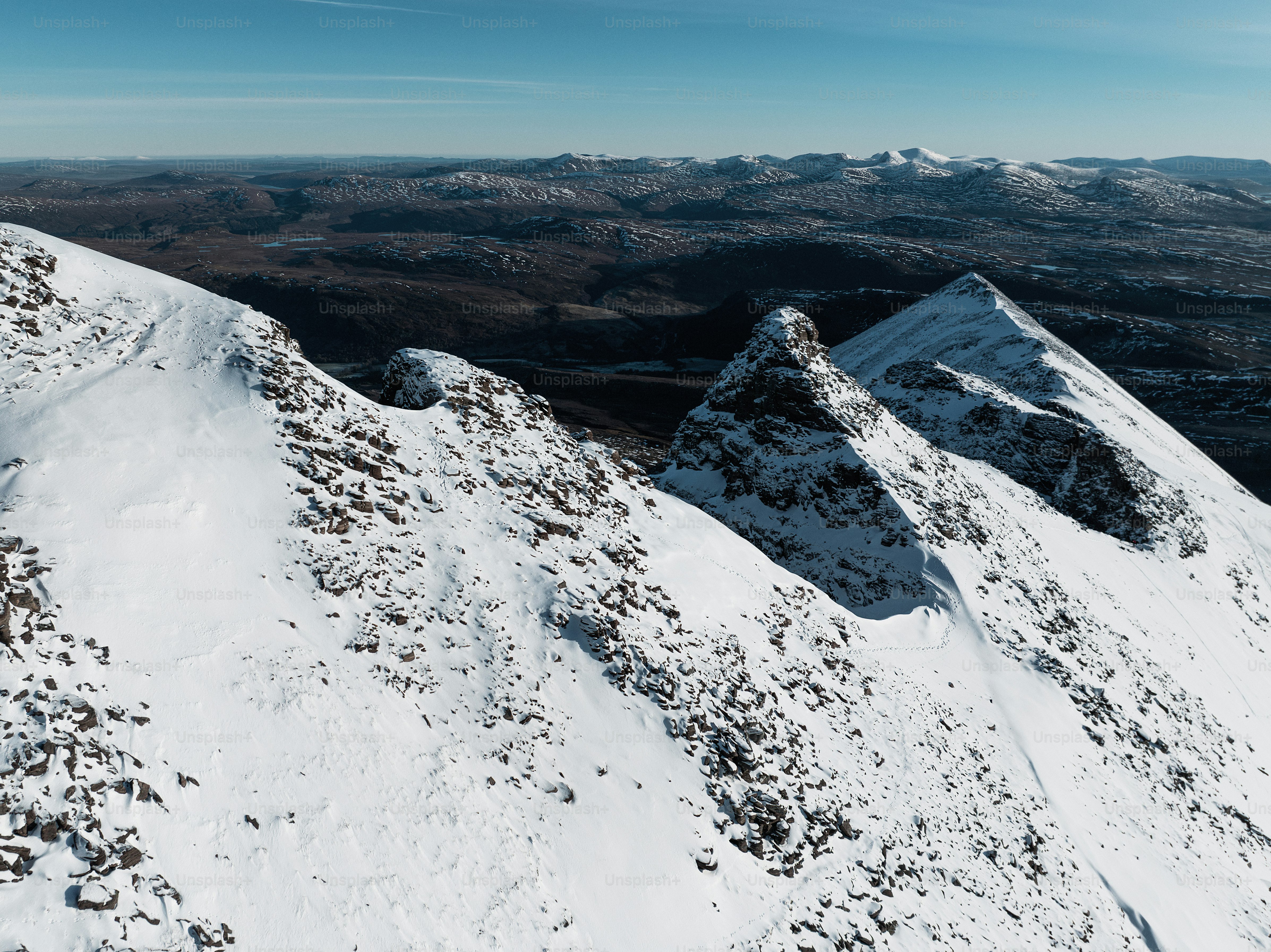 A snow covered mountain with a sky background