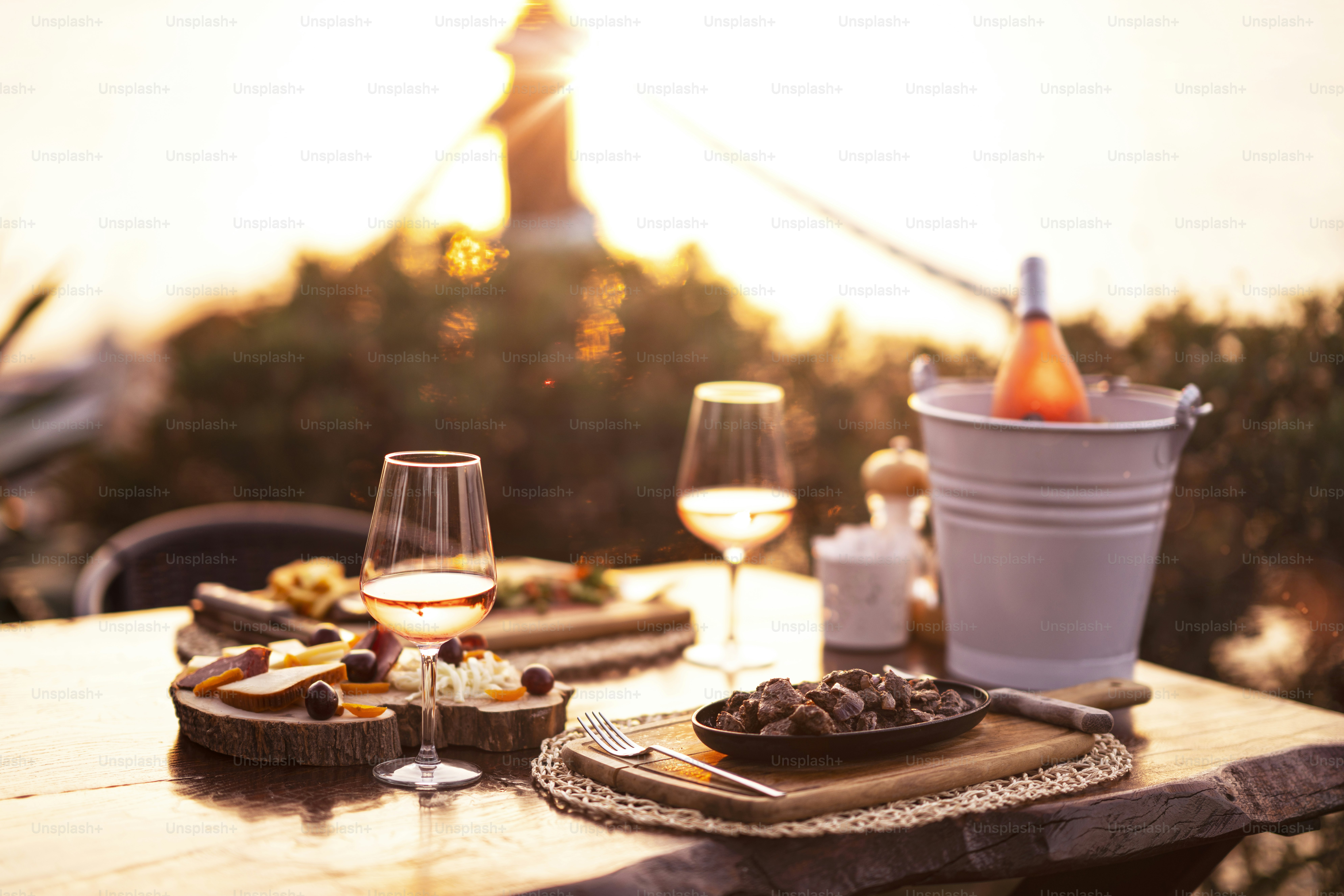 Santorini rooftops at golden hour, setting for outdoor dining