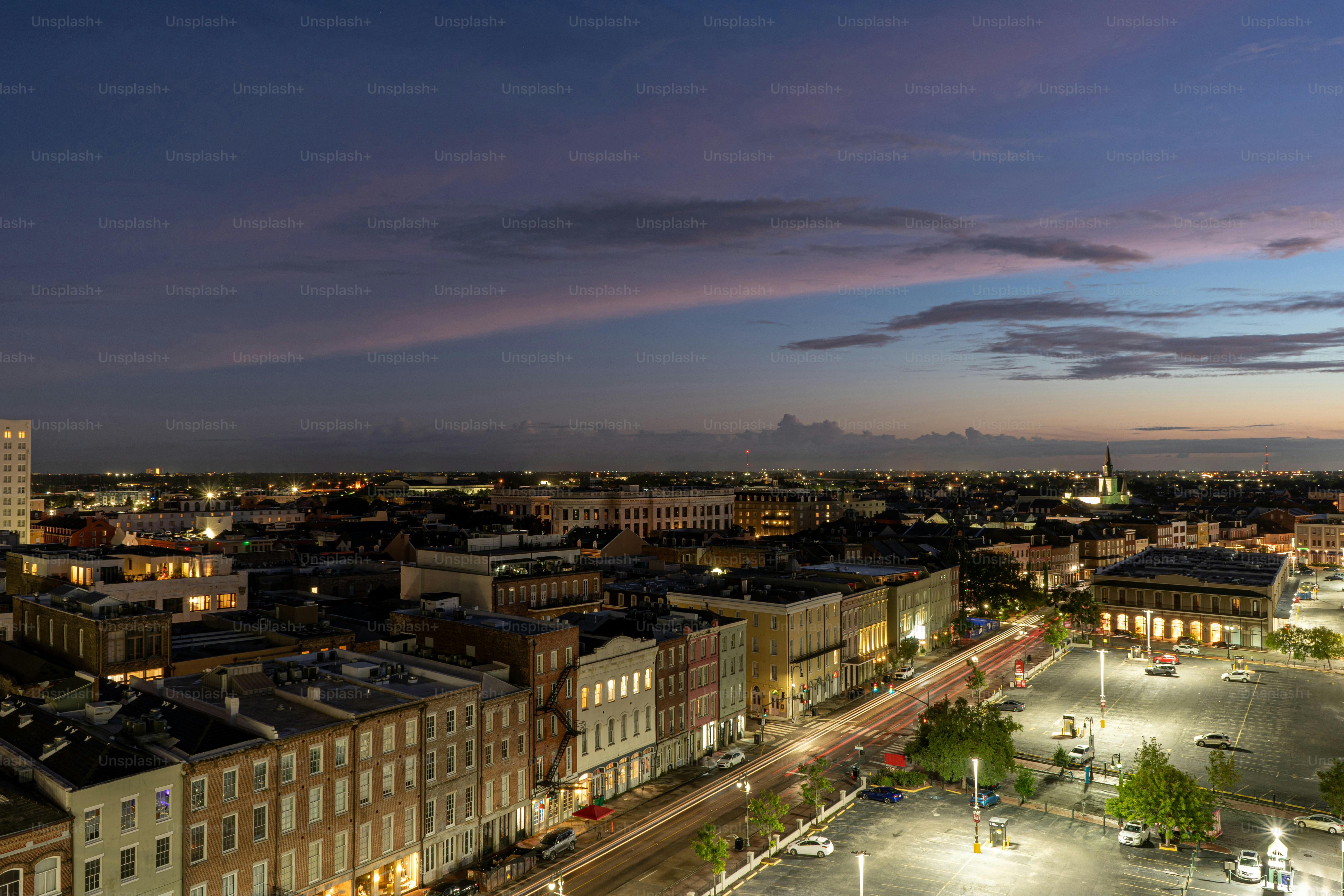 A vibrant and colorful sunrise explodes over the French Quarter of New Orleans, Louisiana in the early hours of the day.
