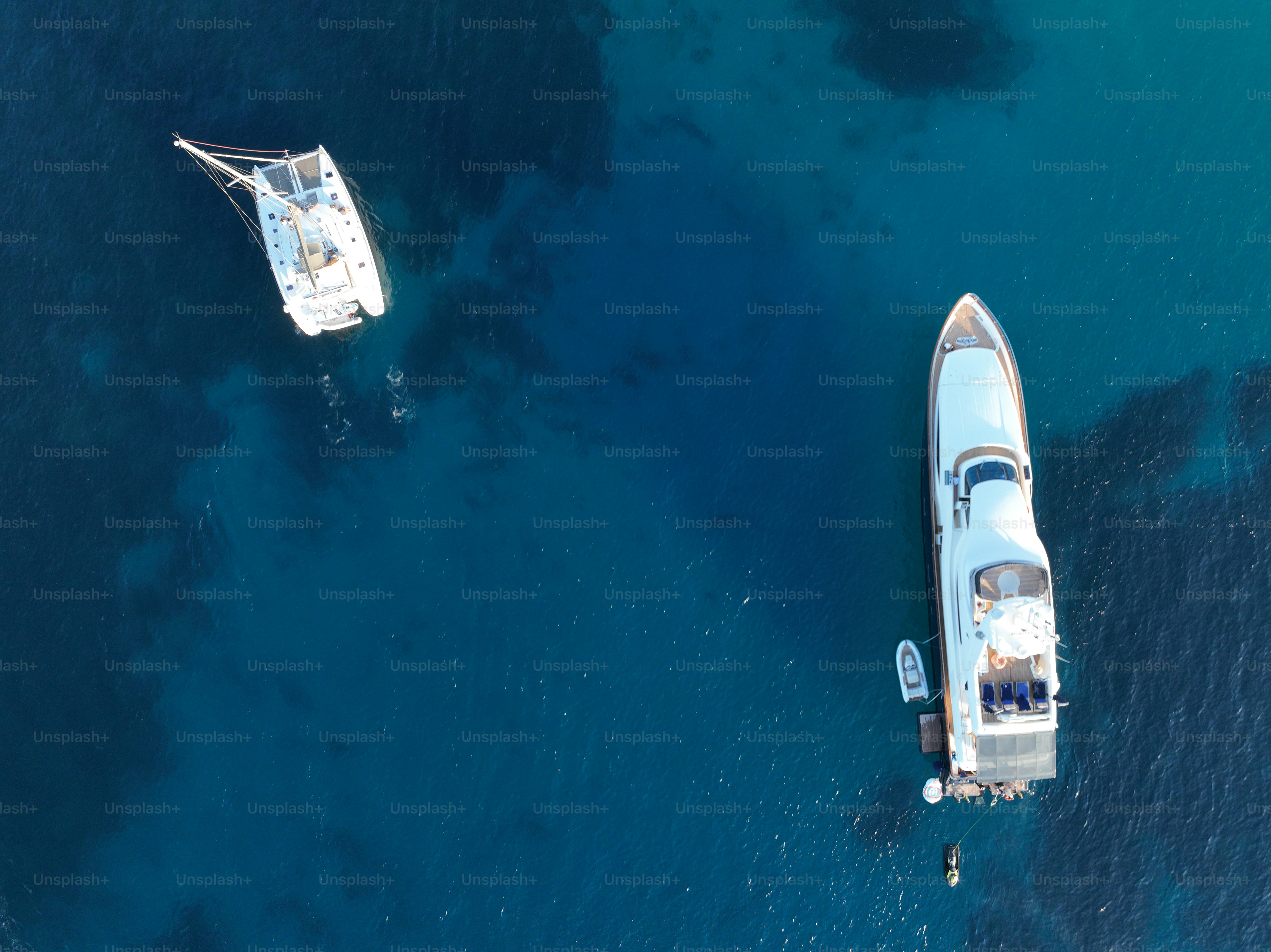 Aerial view of ships in the sea. Crystalline waters.