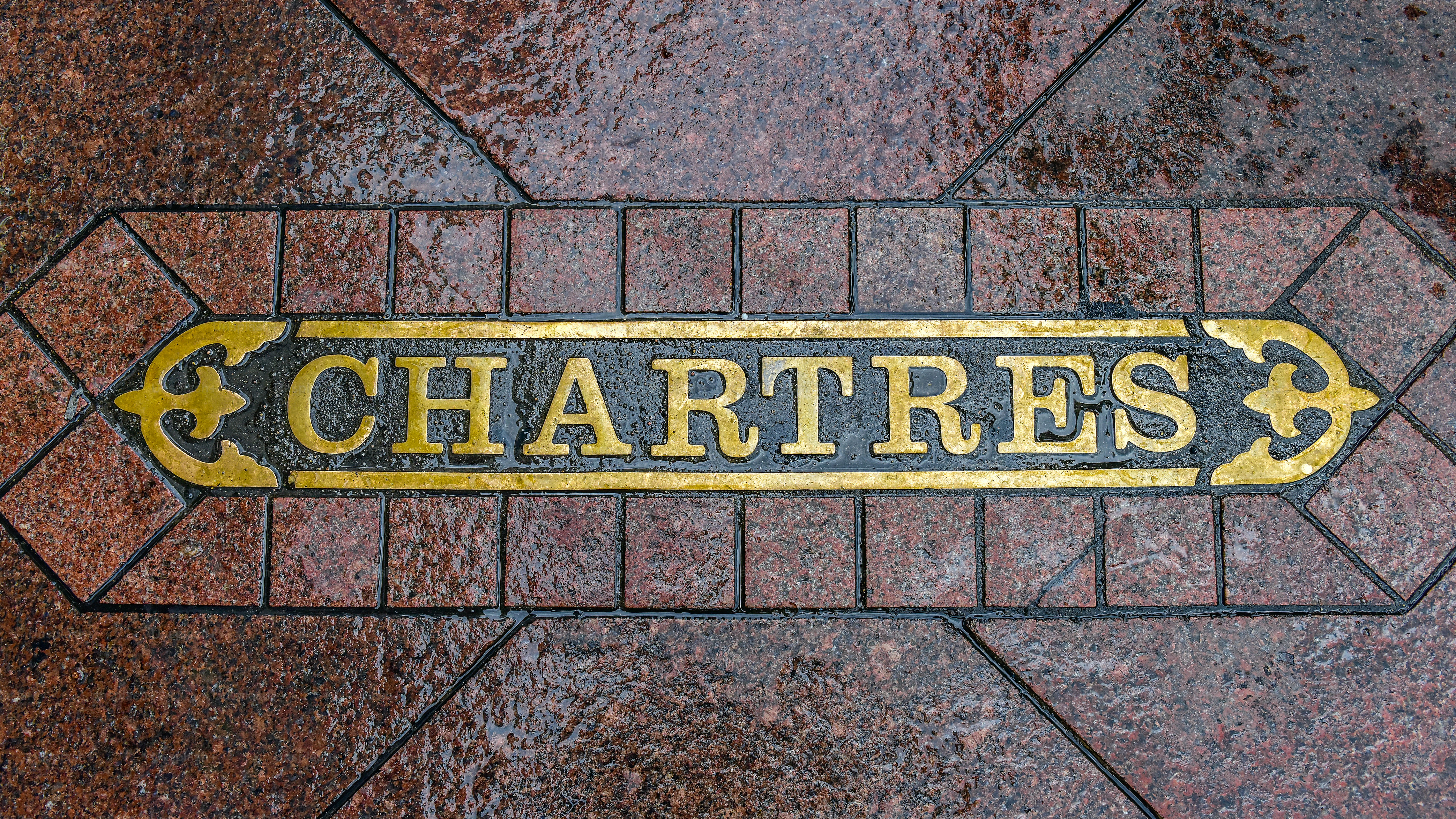 Chartres Street sign at sidewalk of downtown district, New Orleans.