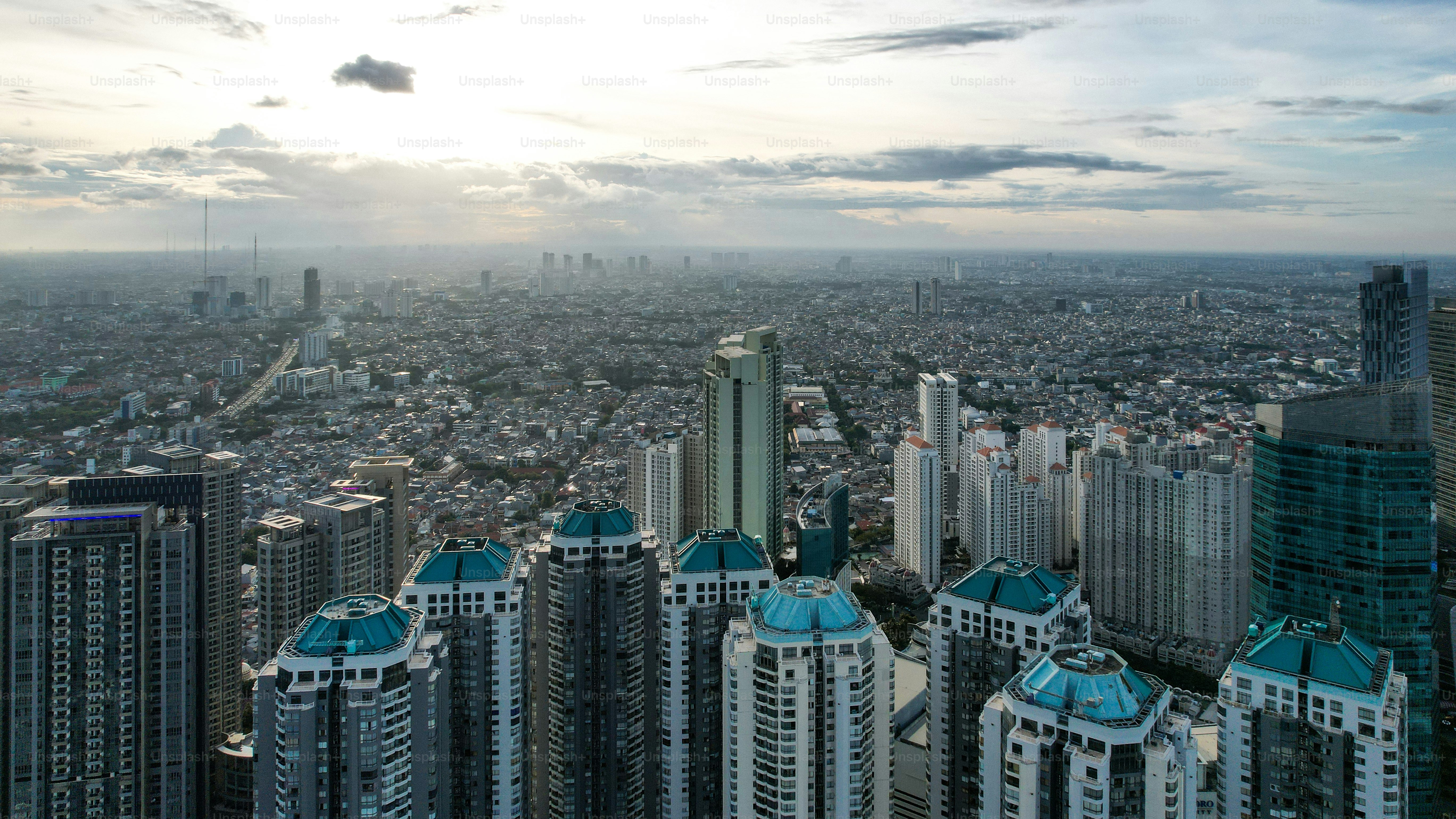 Aerial view of Taman Anggrek the biggest shopping mall and apartment in Jakarta when sunrise.