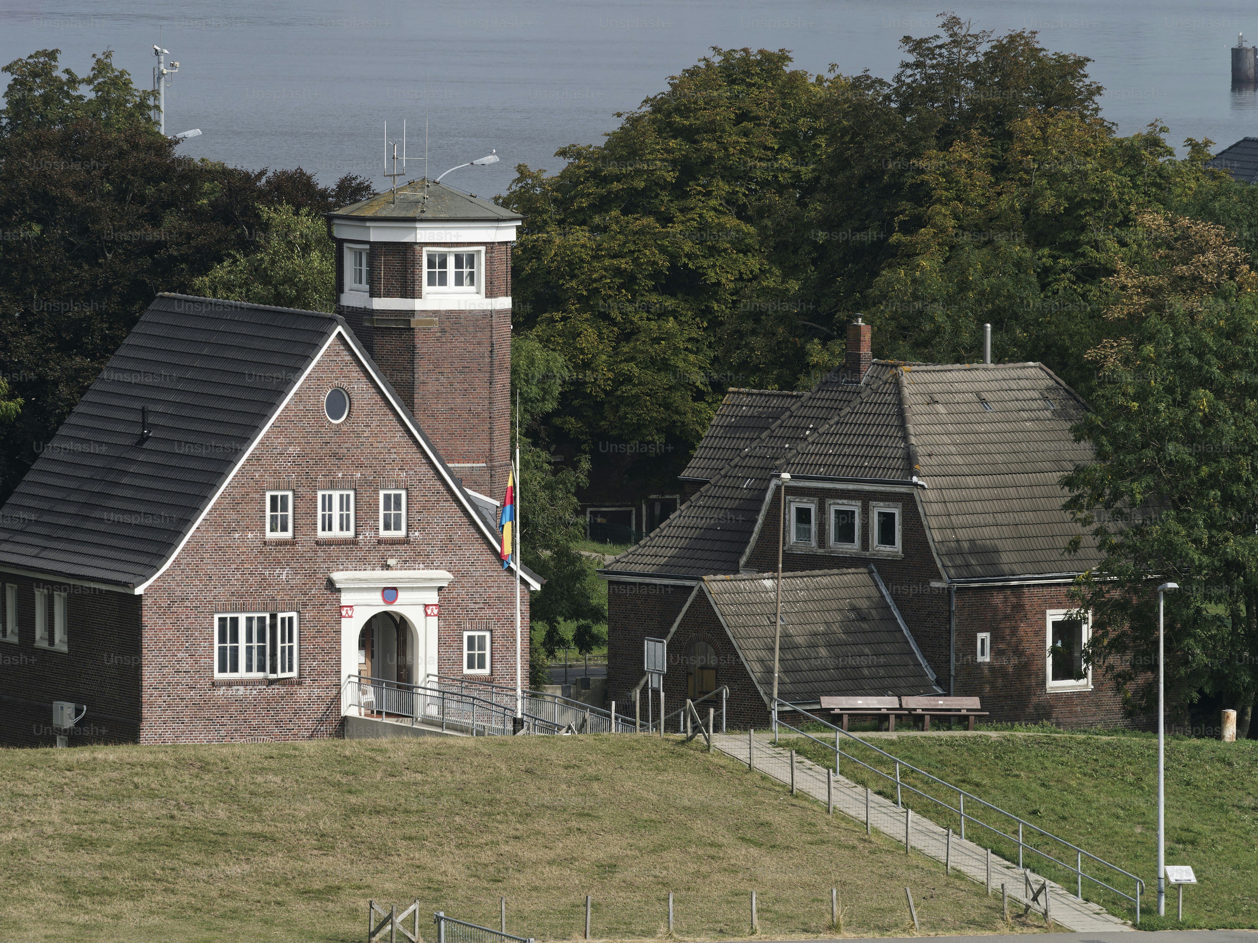 Beautiful traditional brick building - is an observation tower at the entrance to the port of Emden.