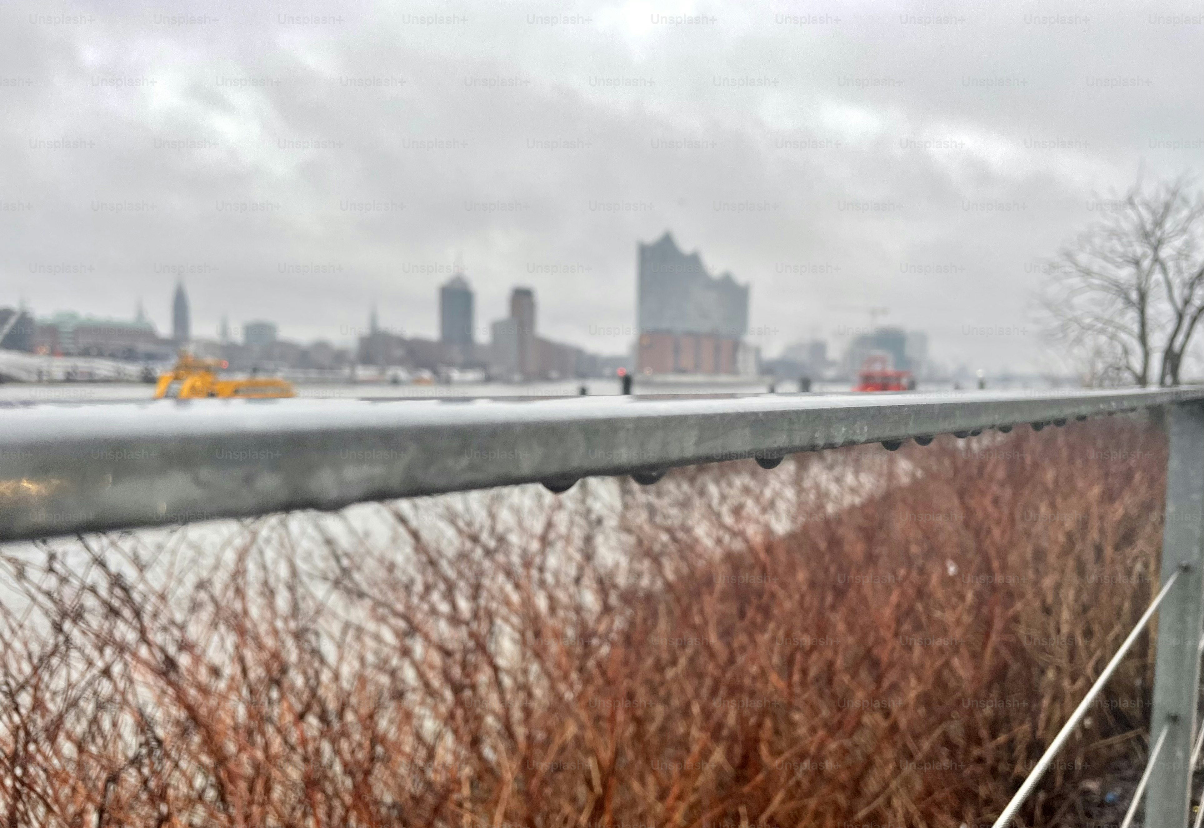 A grey and rainy day in Hamburg with a view on the Elbe River and Elbphilhamonie.