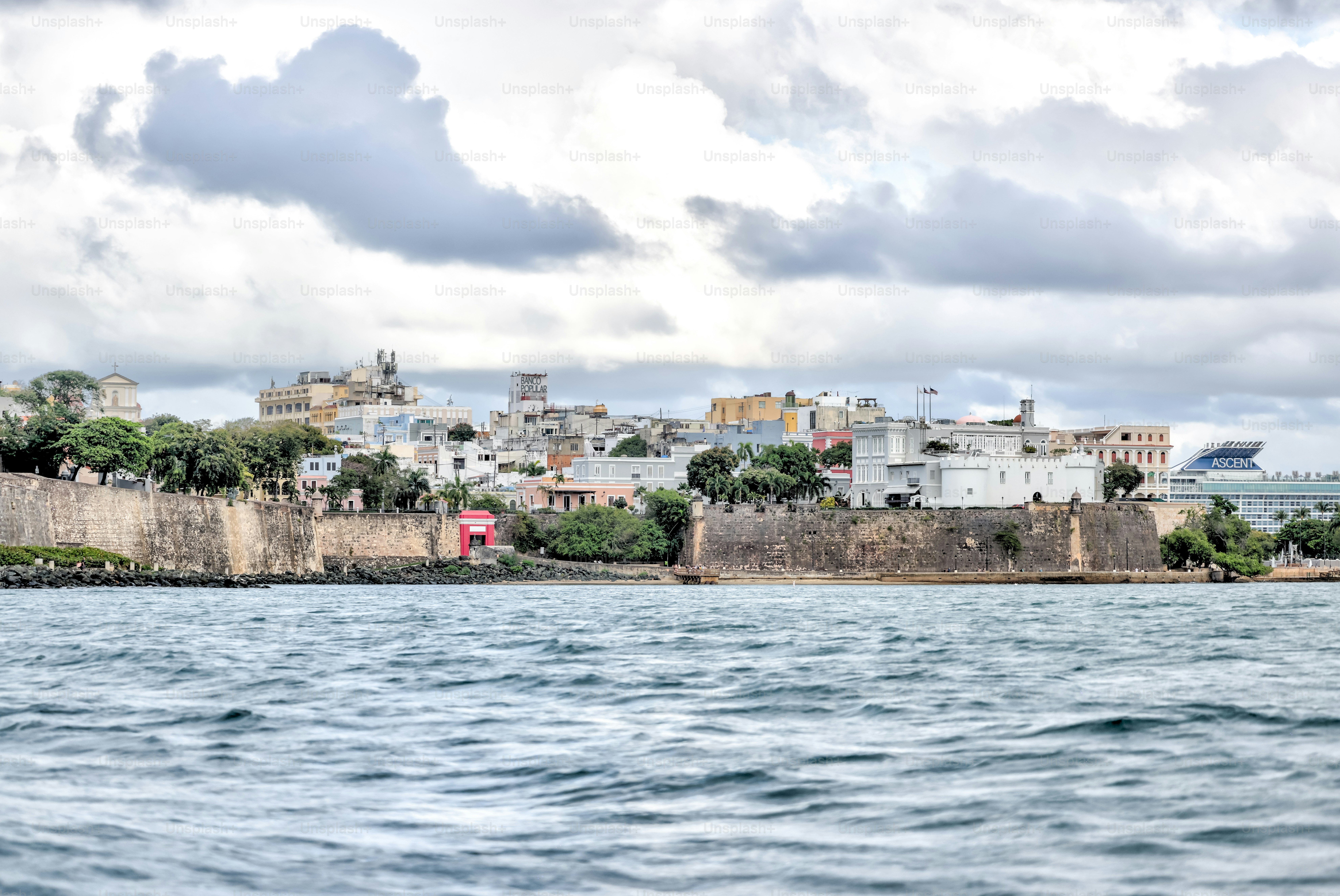 San Juan, Puerto Rico - March 26, 2024: View from the water of the forttified walls and old town of San Juan, Puerto Rico