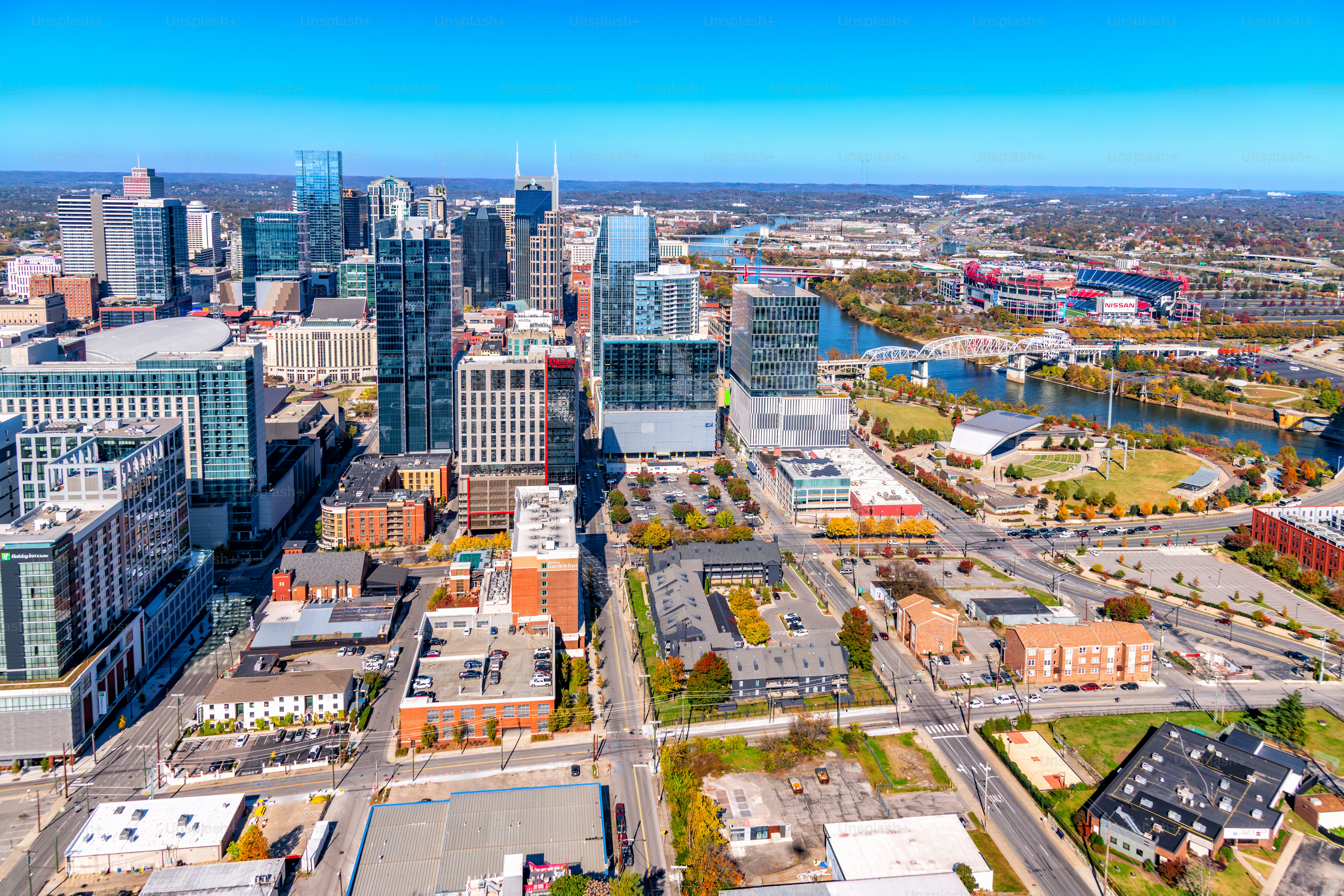 The downtown skyline of Nashville, Tennessee along the banks of the Cumberland River shot via helicopter from an altitude of about 800 feet.