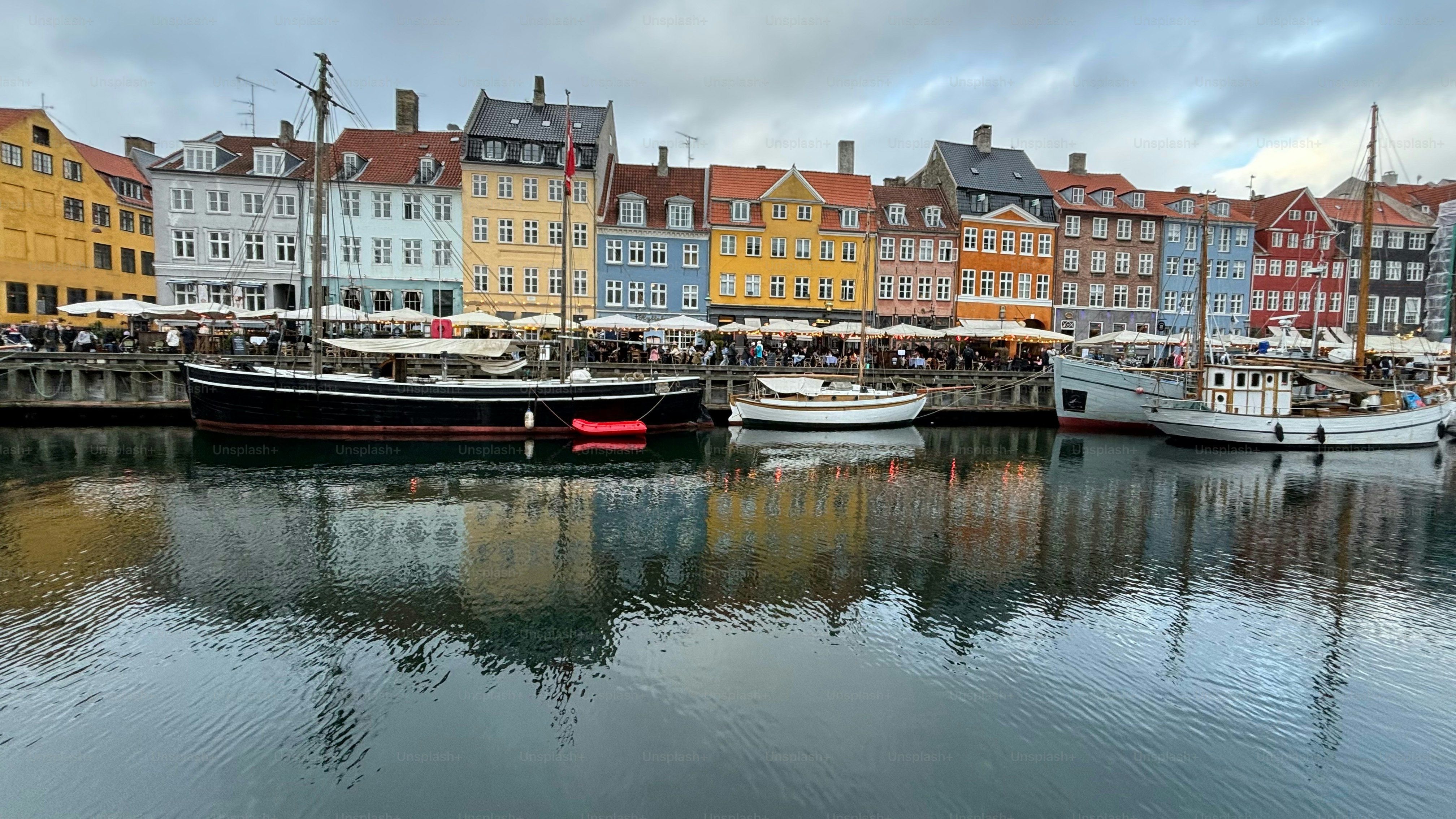 Beautiful Colorful Buildings Lined up on the Waterfront with reflections of those buildings on the water