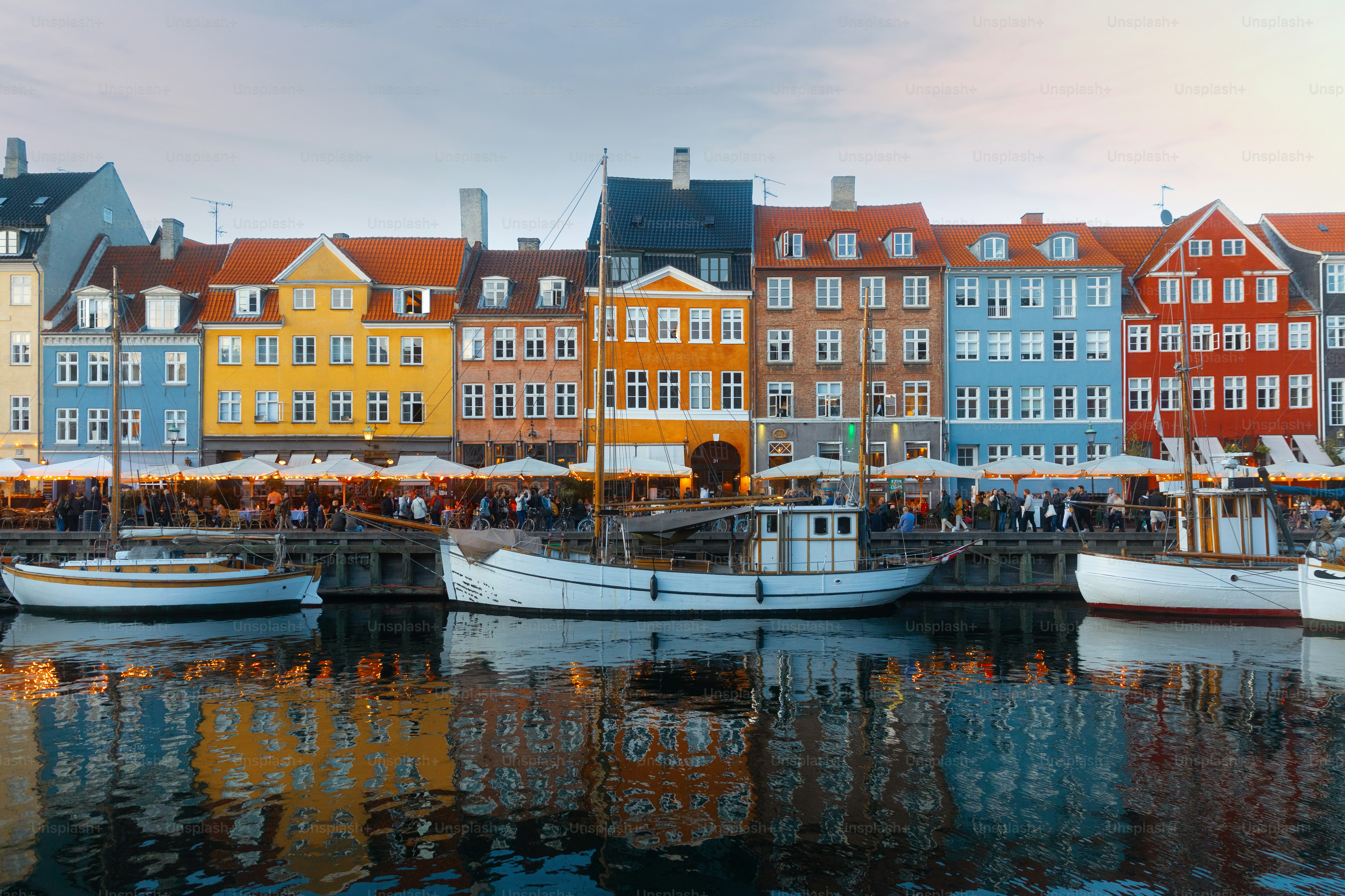 Copenhagen Nyhavn panorama city crowds of people with boats and many small colorful houses