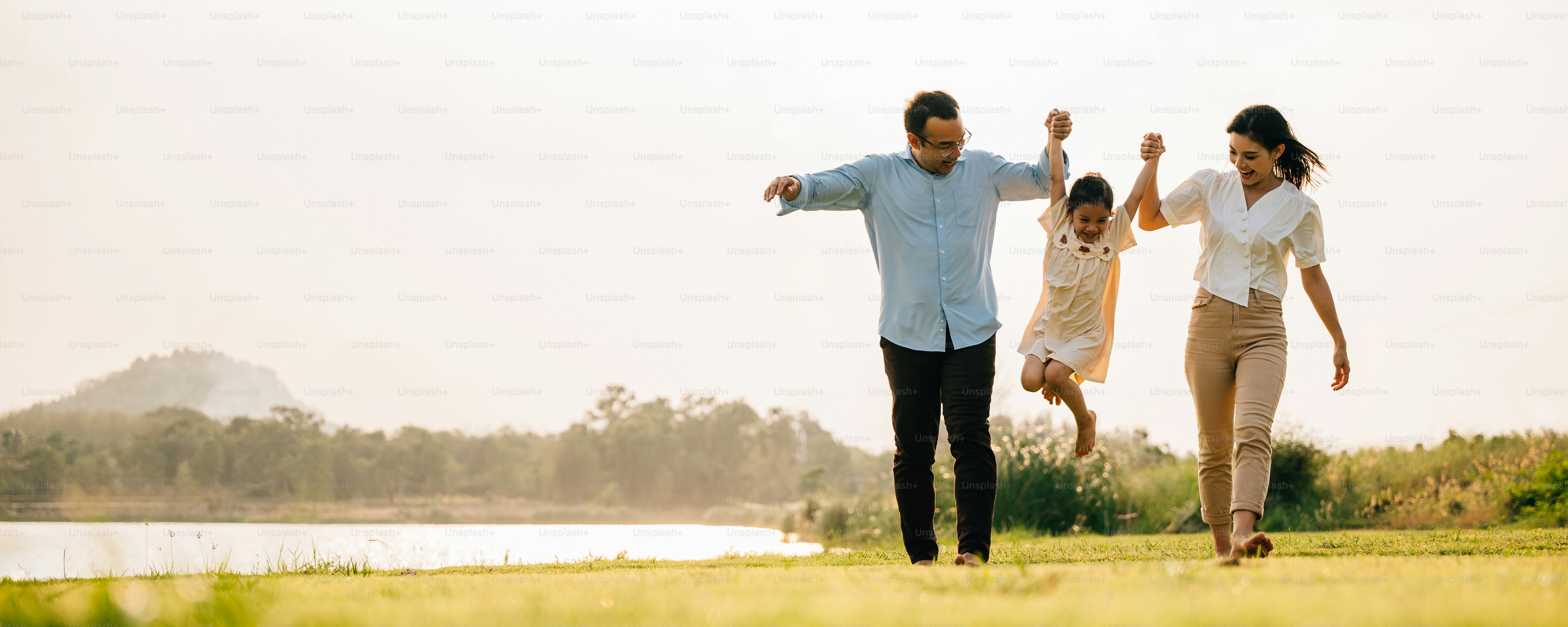 A group of cheerful people walking and having fun together in a beautiful nature setting on a sunny day, feeling the beauty and the energy of the outdoors, Happy family day