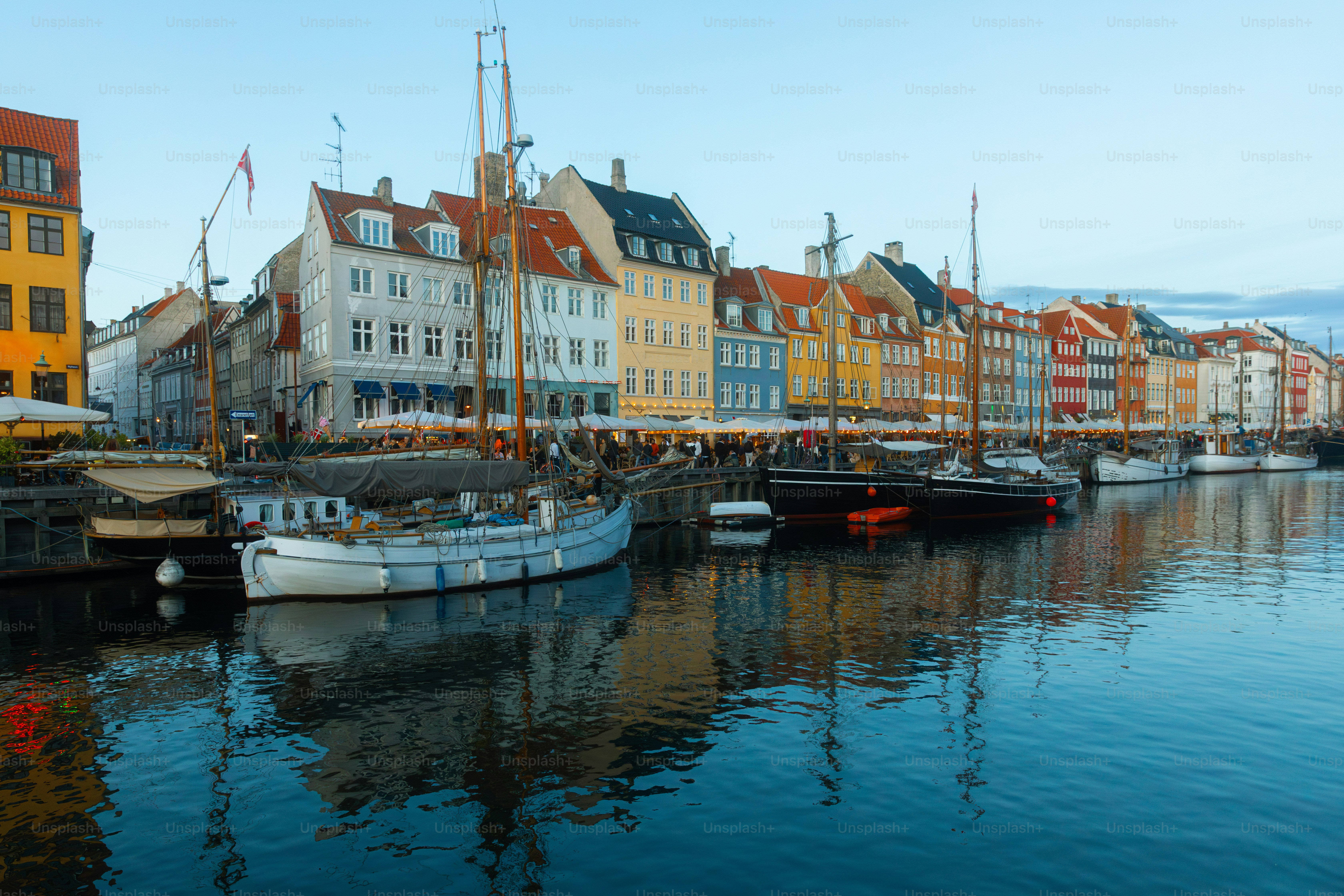 Copenhagen Nyhavn panorama city crowds of people with boats and many small colorful houses