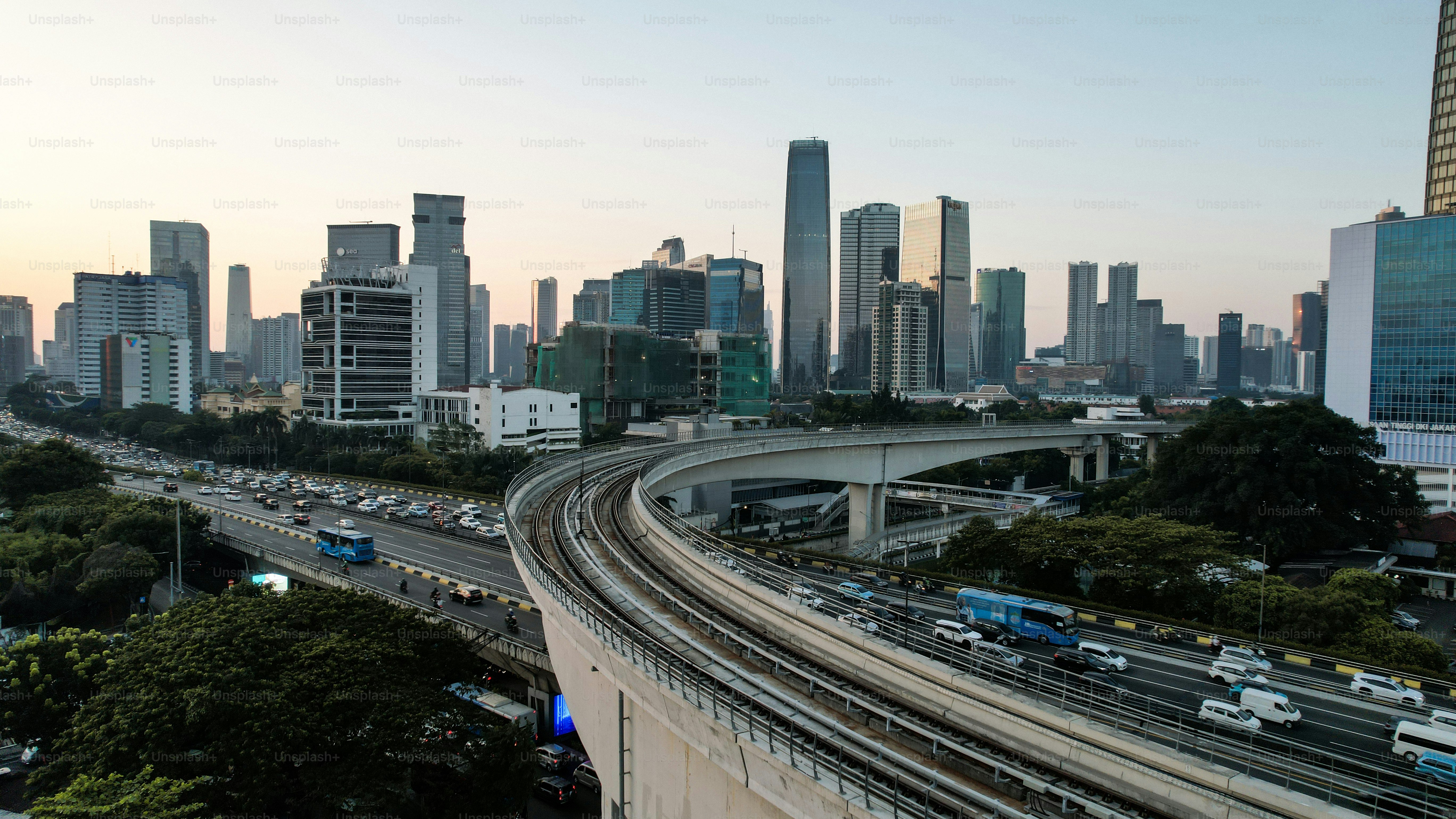 Aerial view of office buildings in Jakarta central business district and noise cloud when sunset. Jakarta, Indonesia, September 2 2023