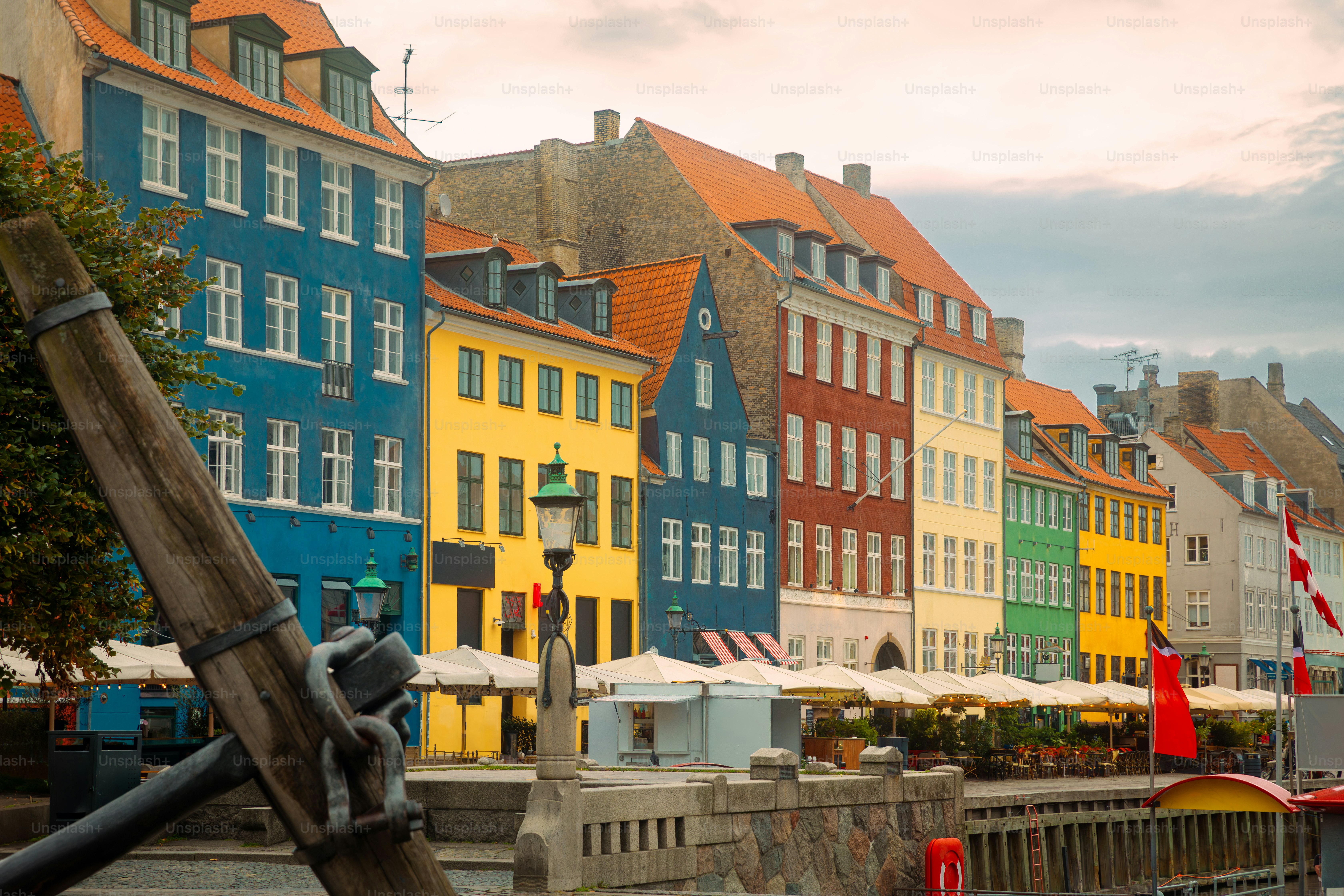 Copenhagen Nyhavn panorama city crowds of people with boats and many small colorful houses