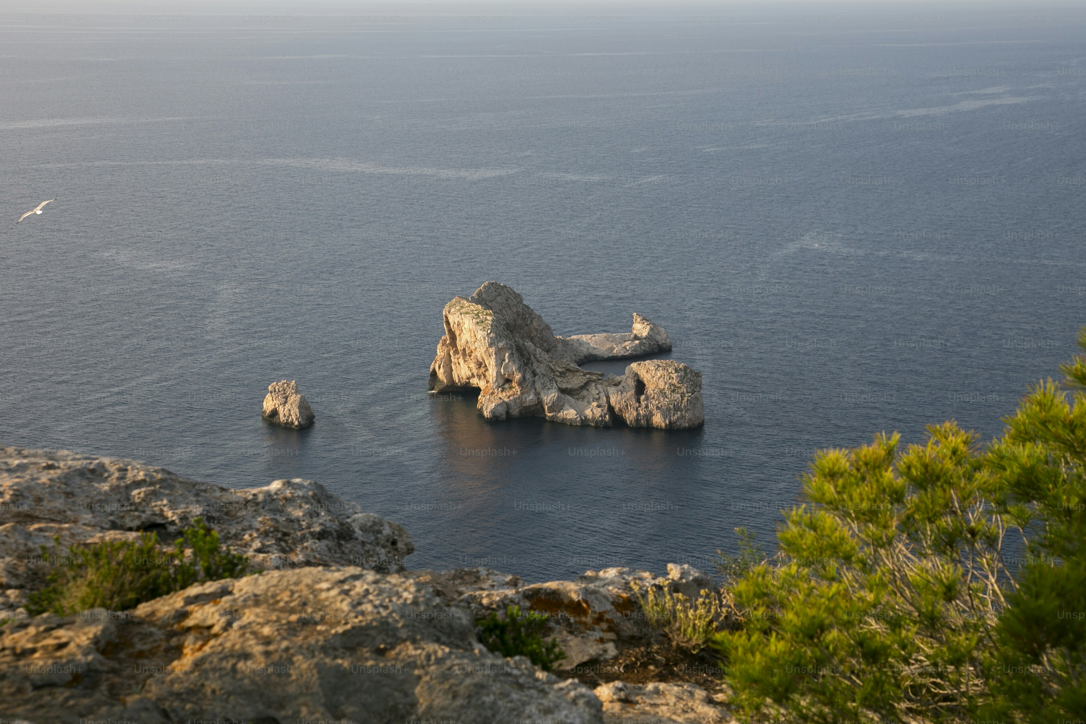 Views of the sea and Ses Margalides of ​​Ibiza from the cliffs in the north of the island in Santa Agnes de Corona.