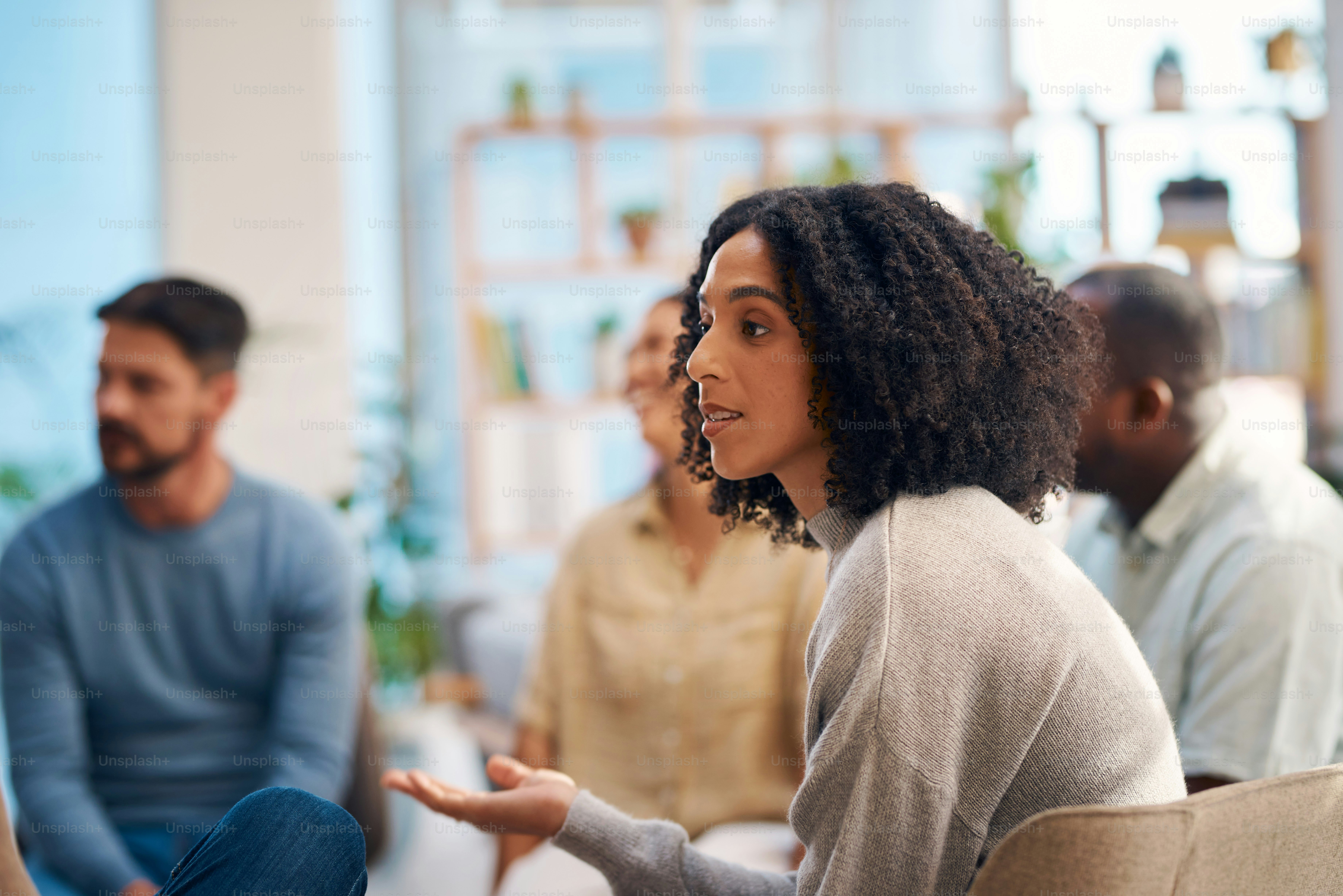 Diverse Group of People Engaging in a Support Group Discussion in a Comfortable Setting