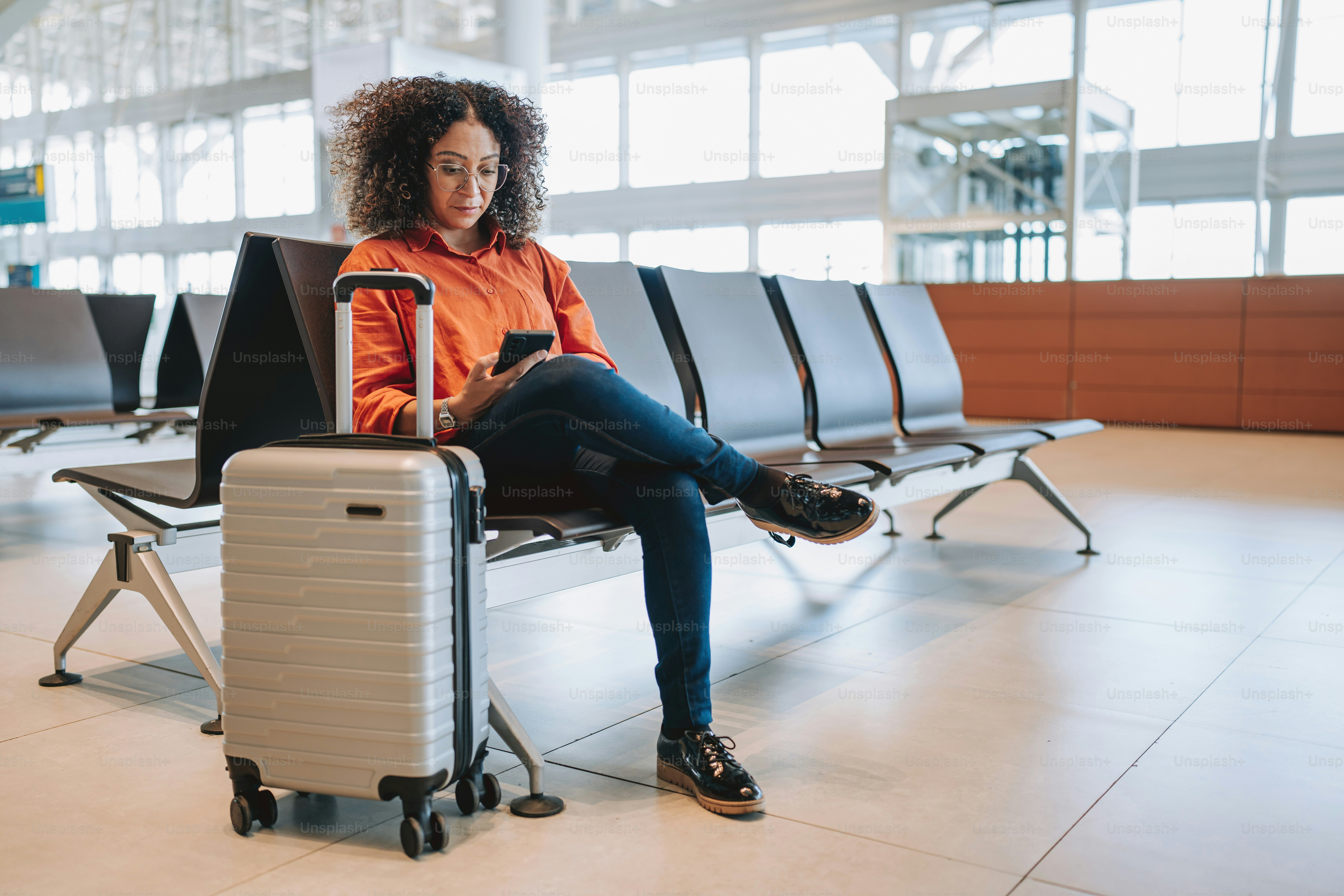 Portrait of a Woman at the Airport Waiting Sitting