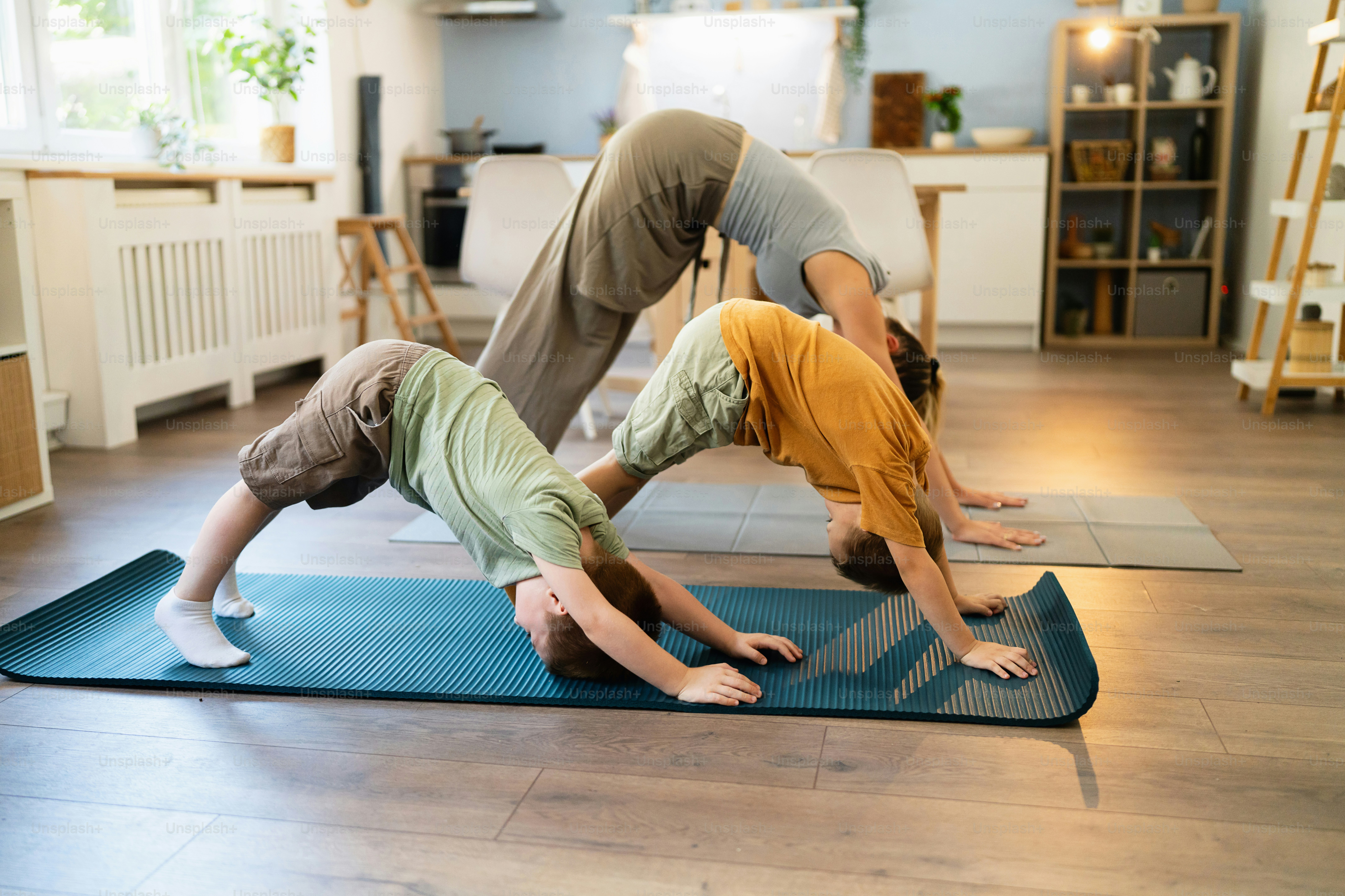 Woman exercising at home with her two sons.