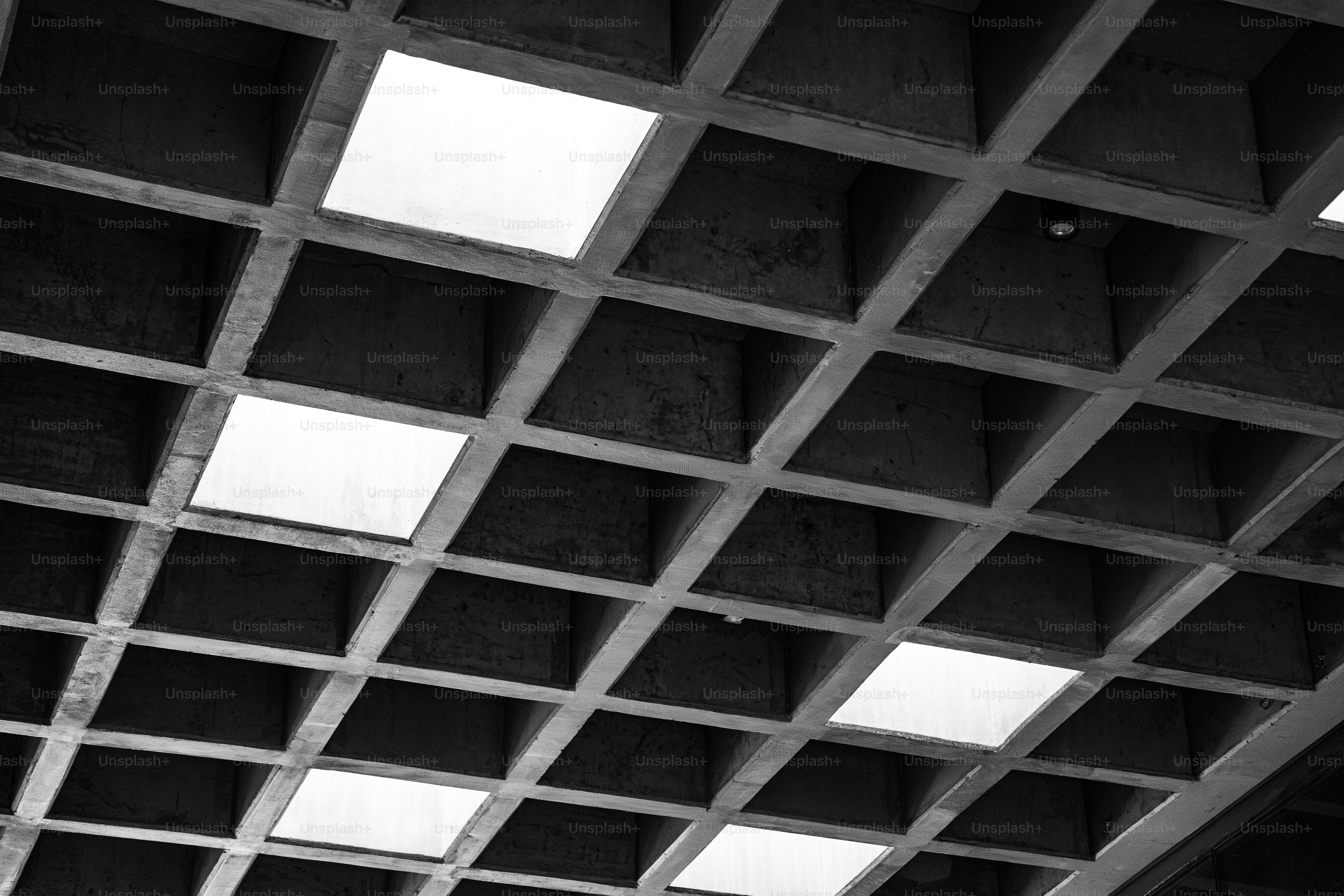 A black and white photo of a ceiling