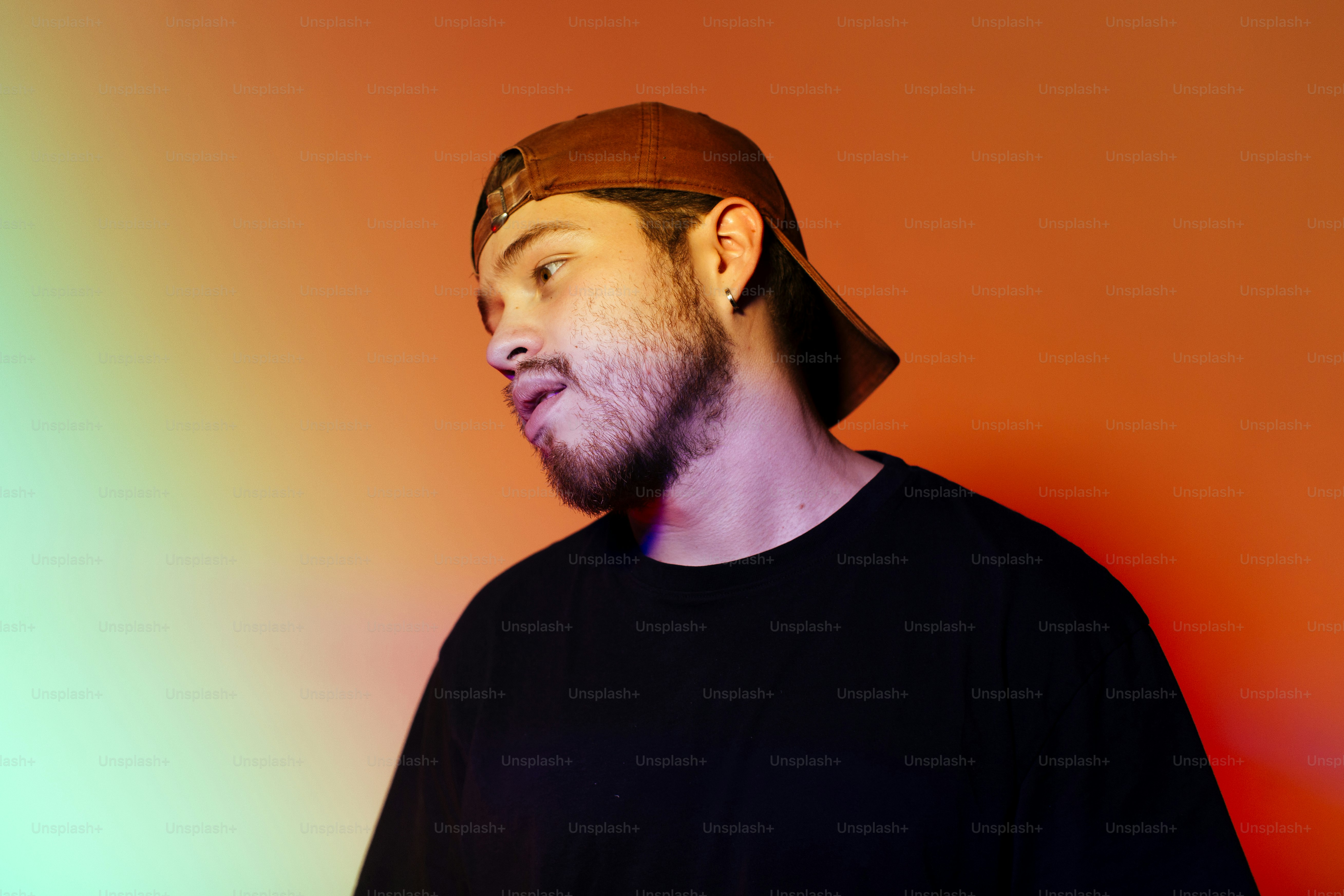 A man in a black shirt and a brown hat