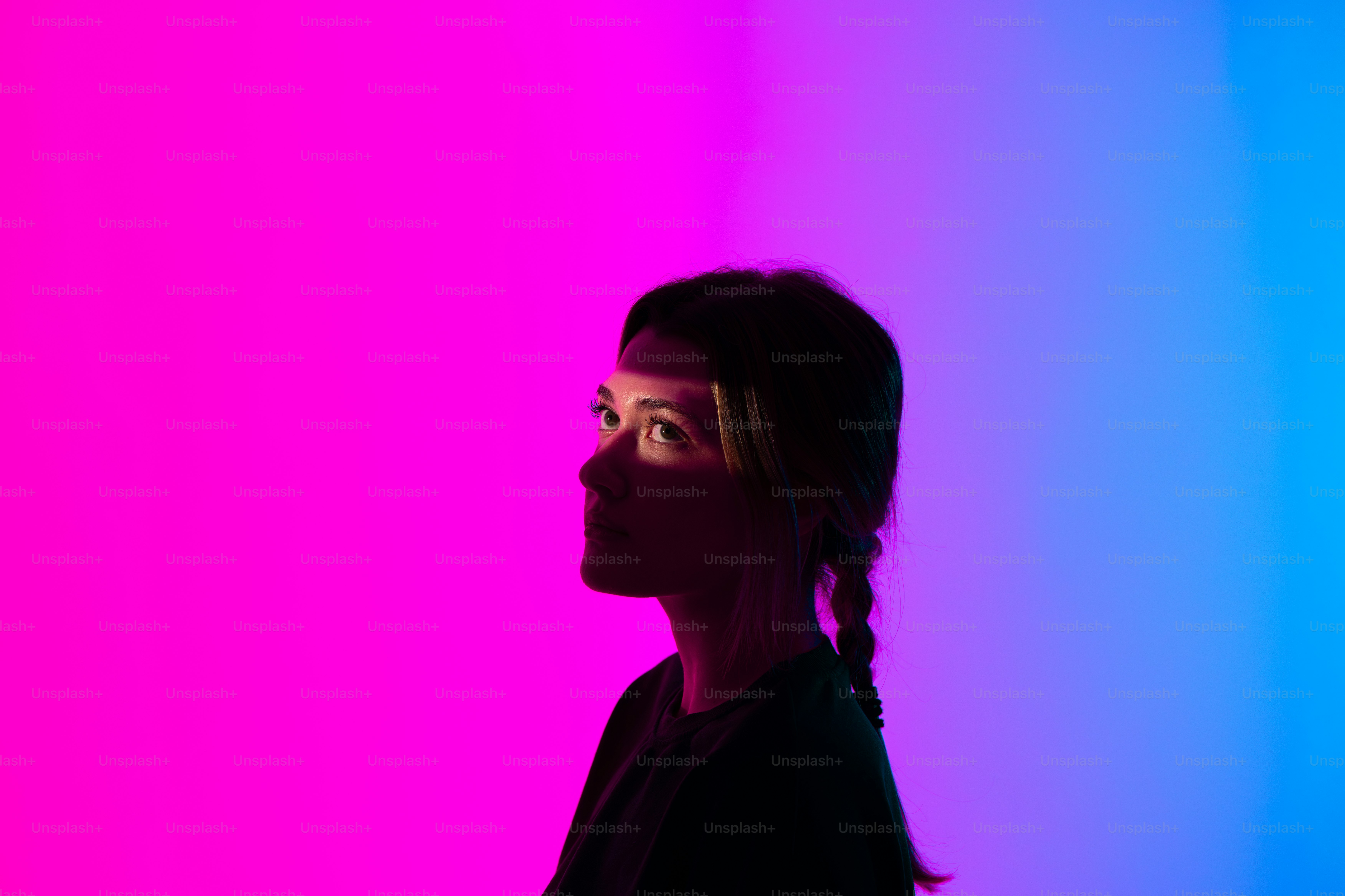 A woman standing in front of a colorful wall photo – Portrait Image on ...