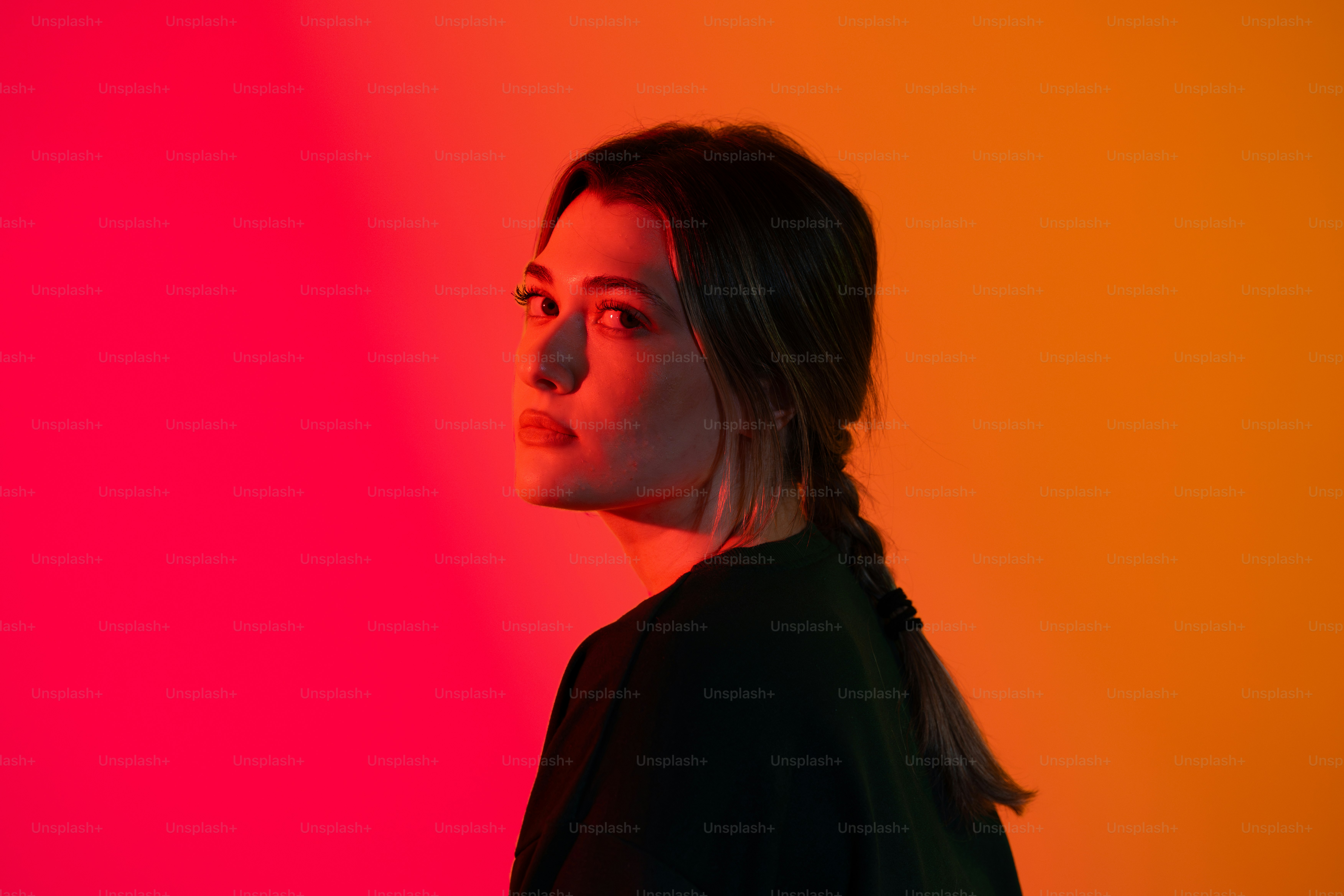 A woman standing in front of a colorful wall photo – Portrait Image on ...