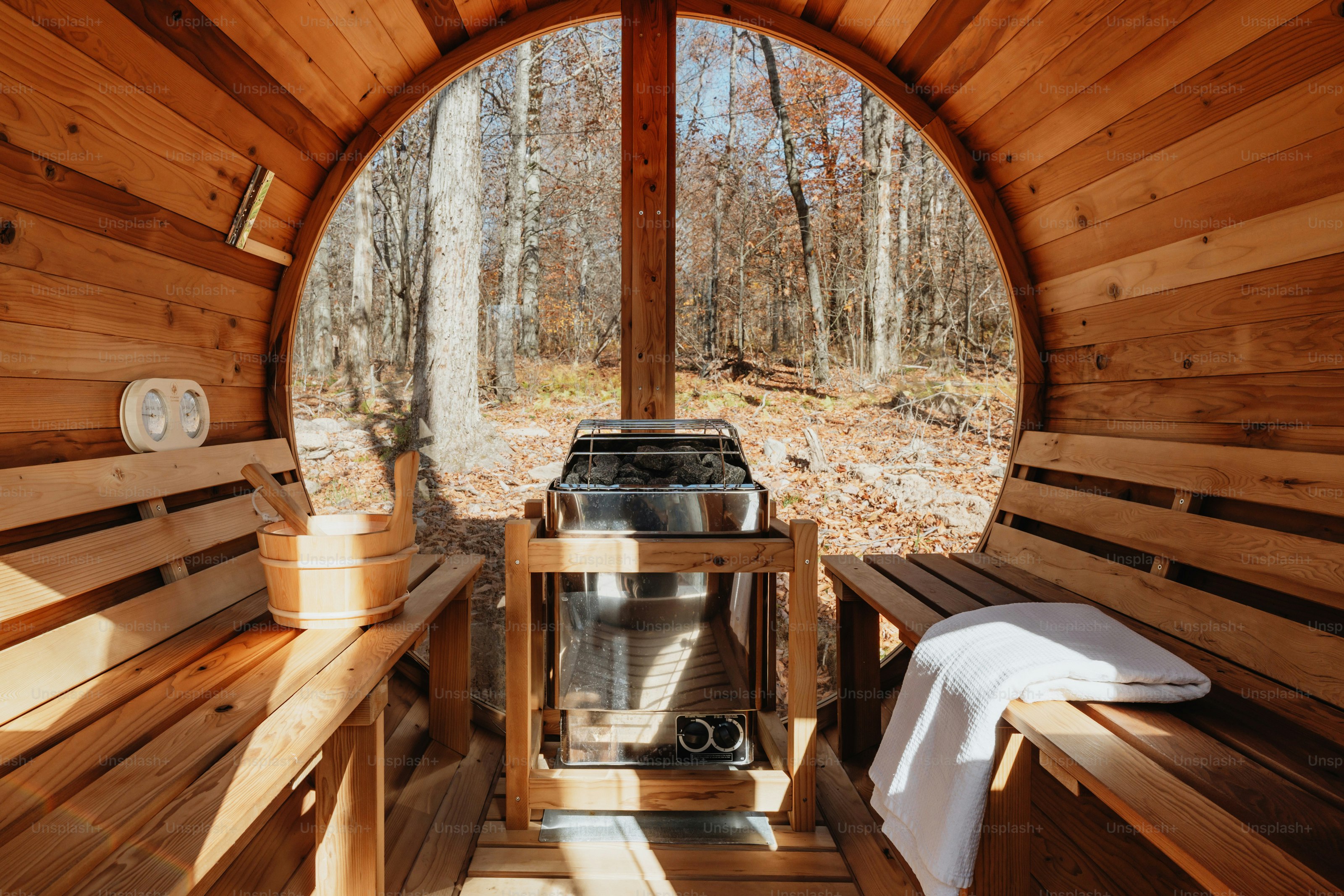 A room with benches and a grill inside of it