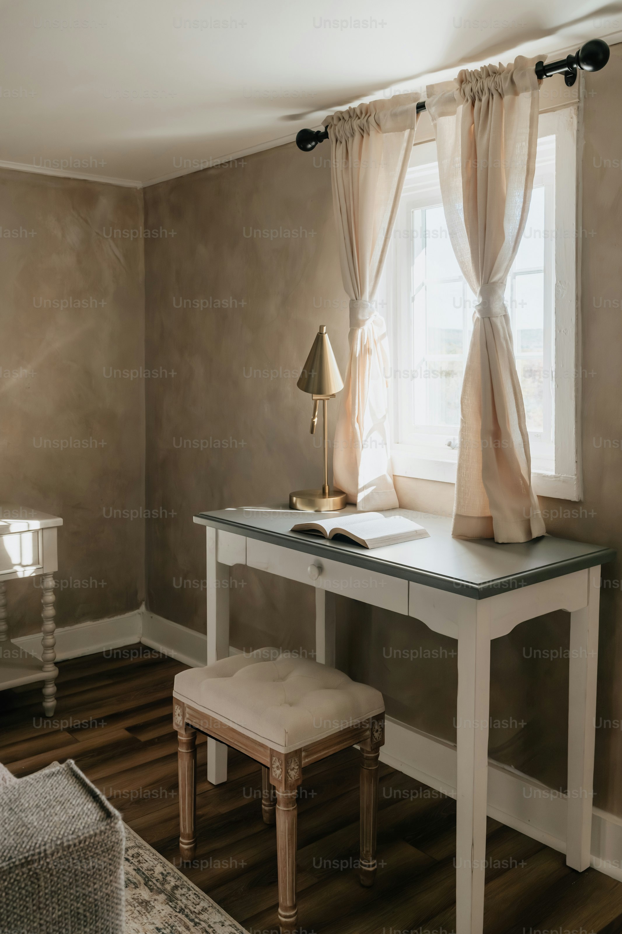 A room with a desk and a chair in it