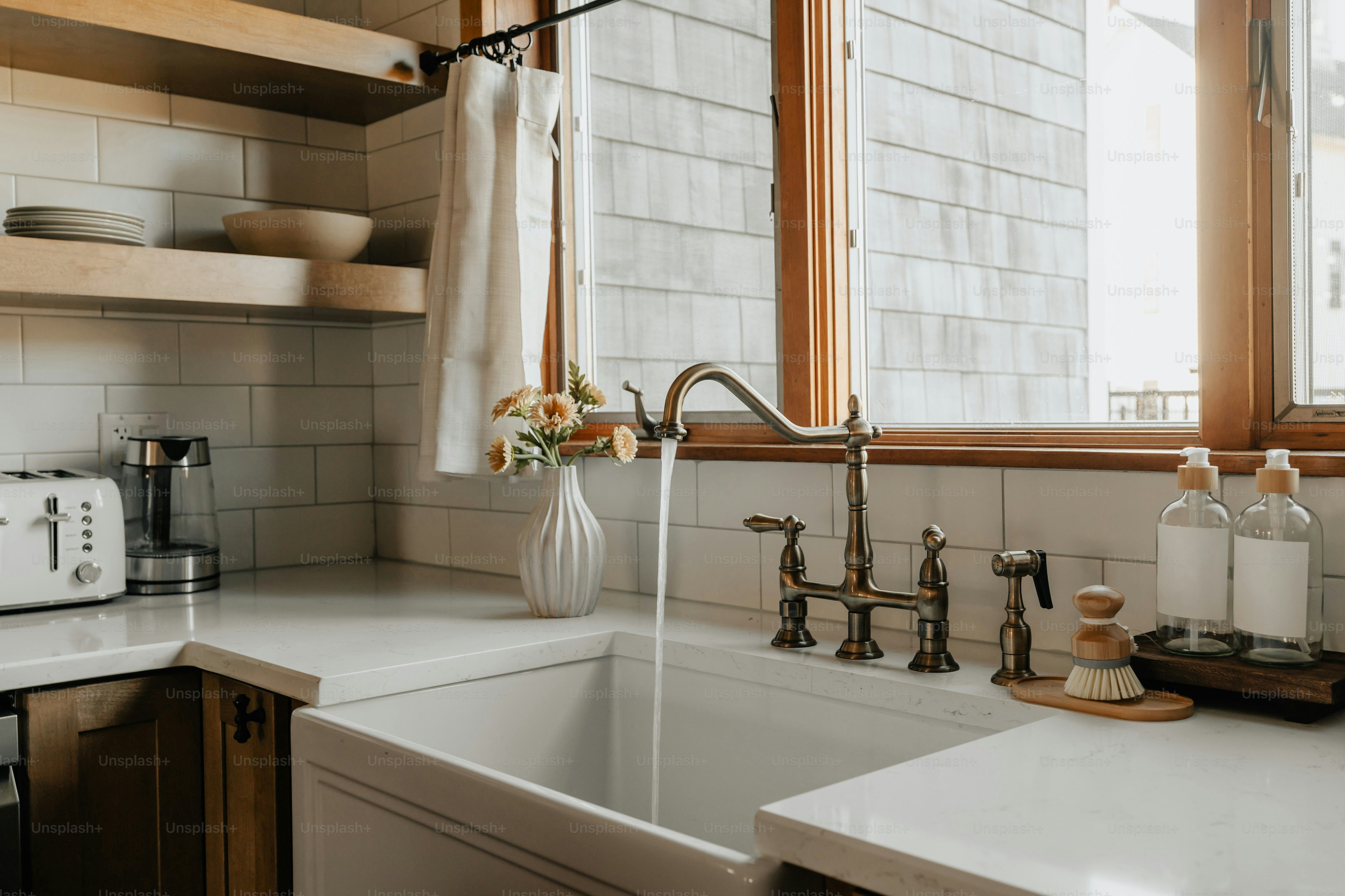 A kitchen with a sink and a window