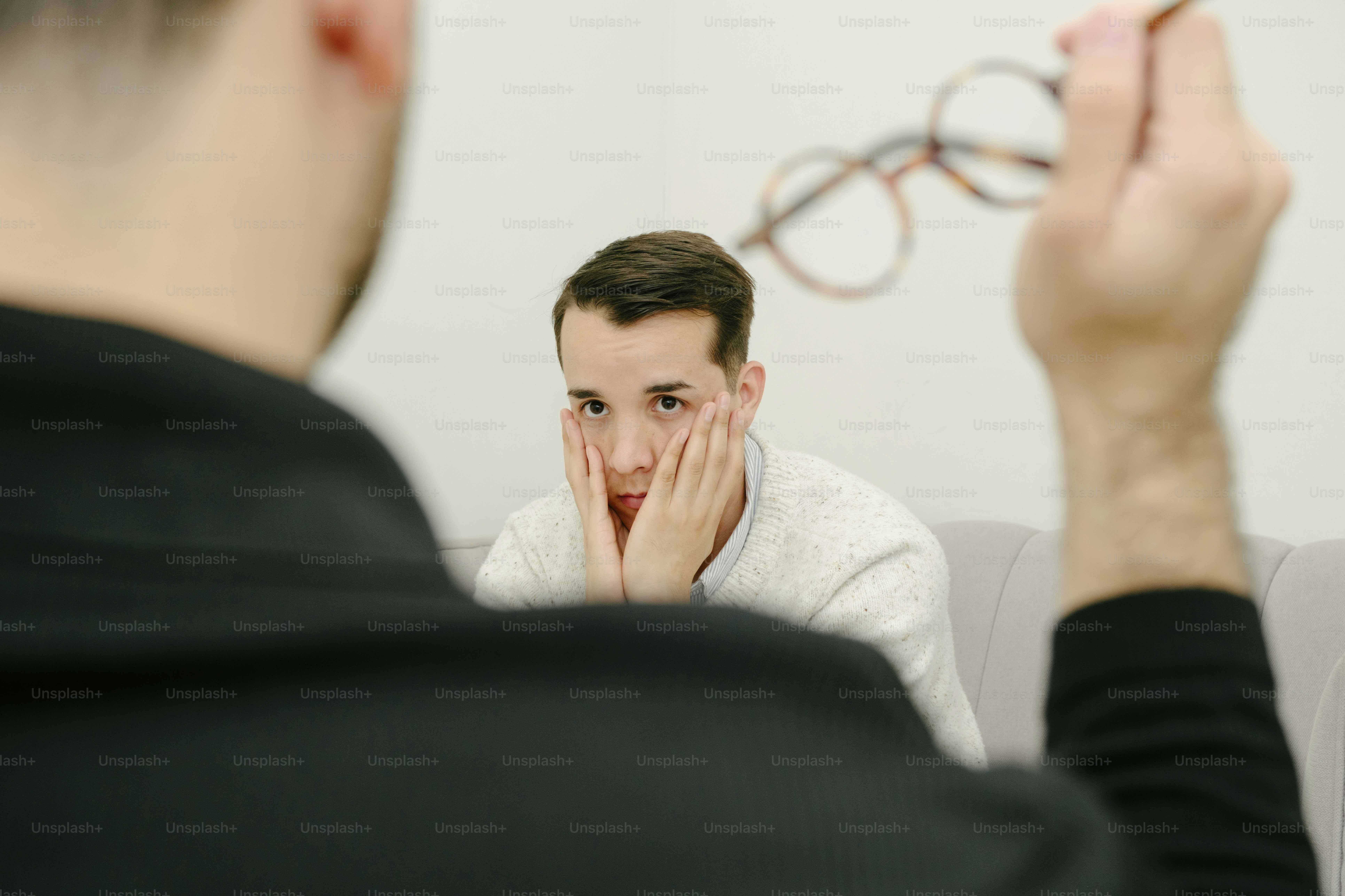 A man looking at his reflection in a mirror