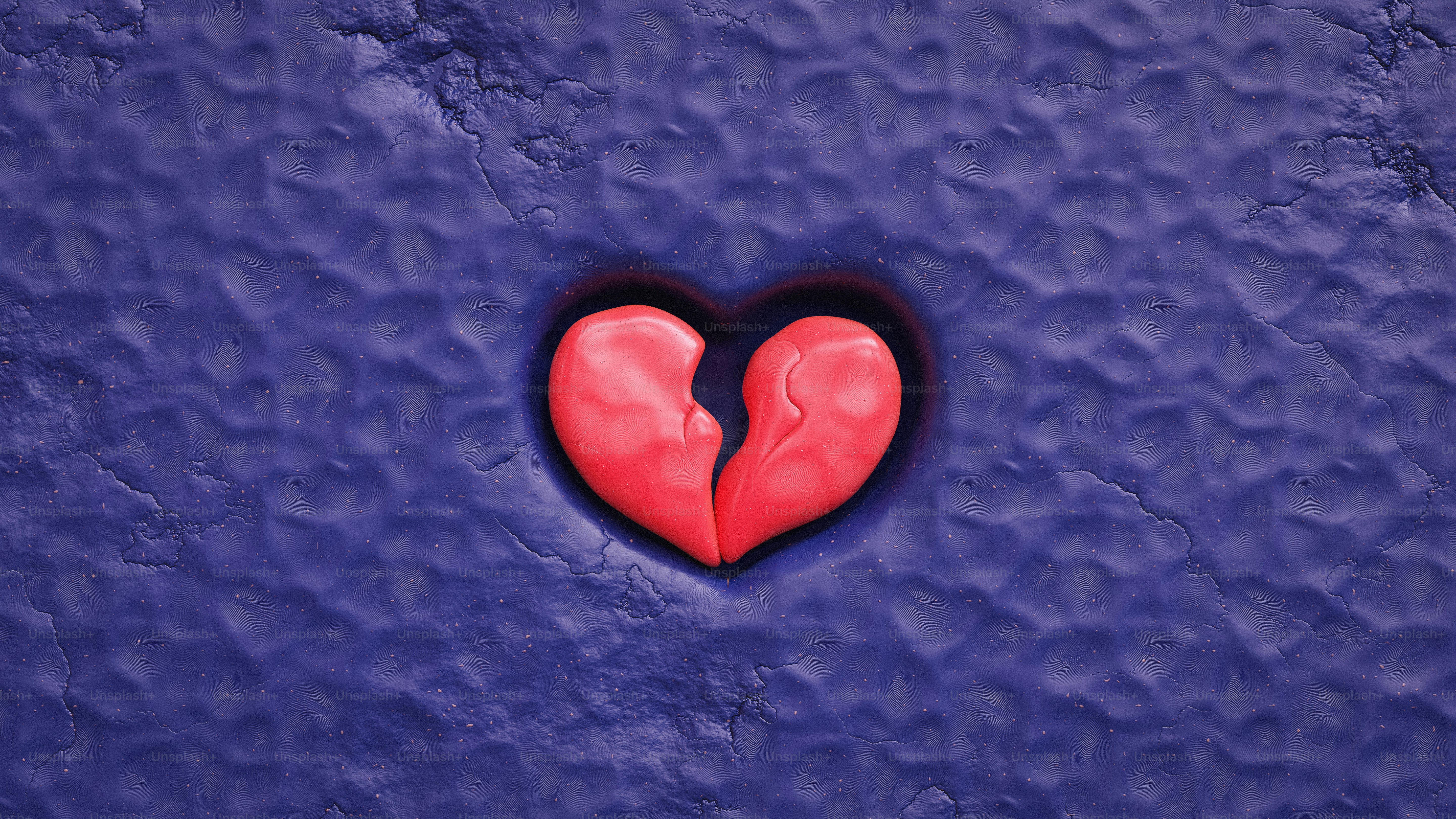 A broken heart on a blue surface
