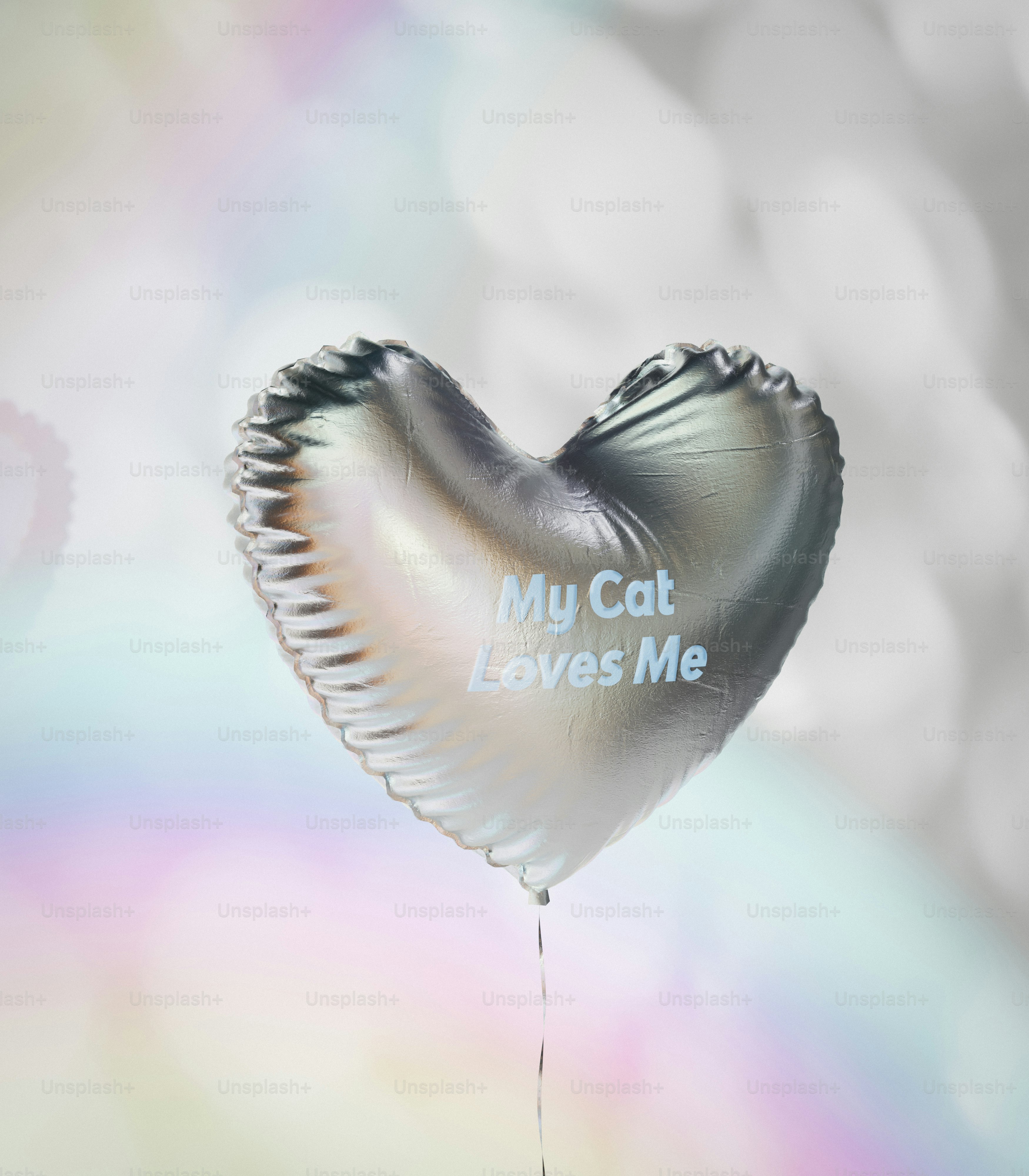 A heart shaped balloon with a message on it