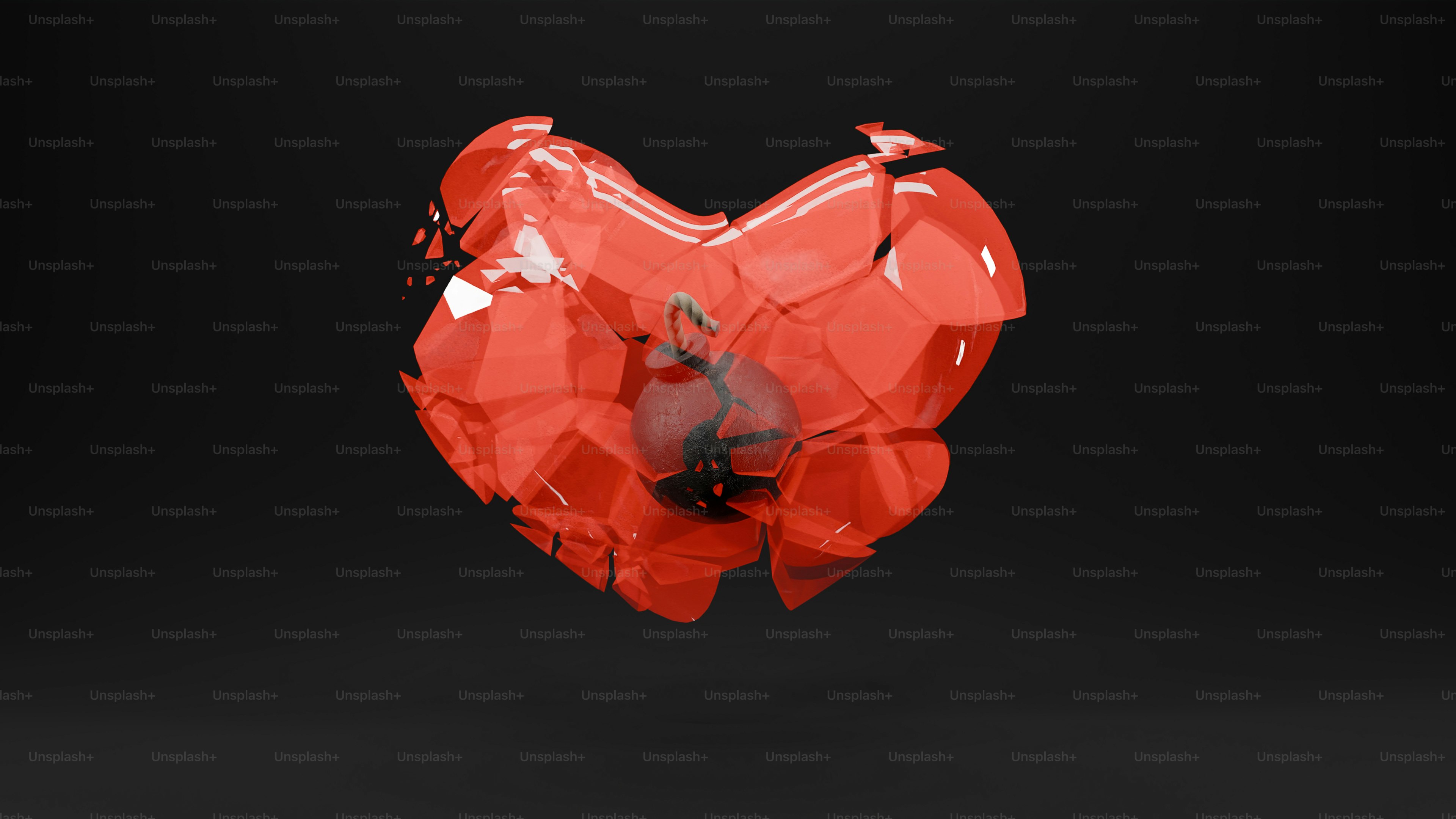 A red heart shaped object on a black background