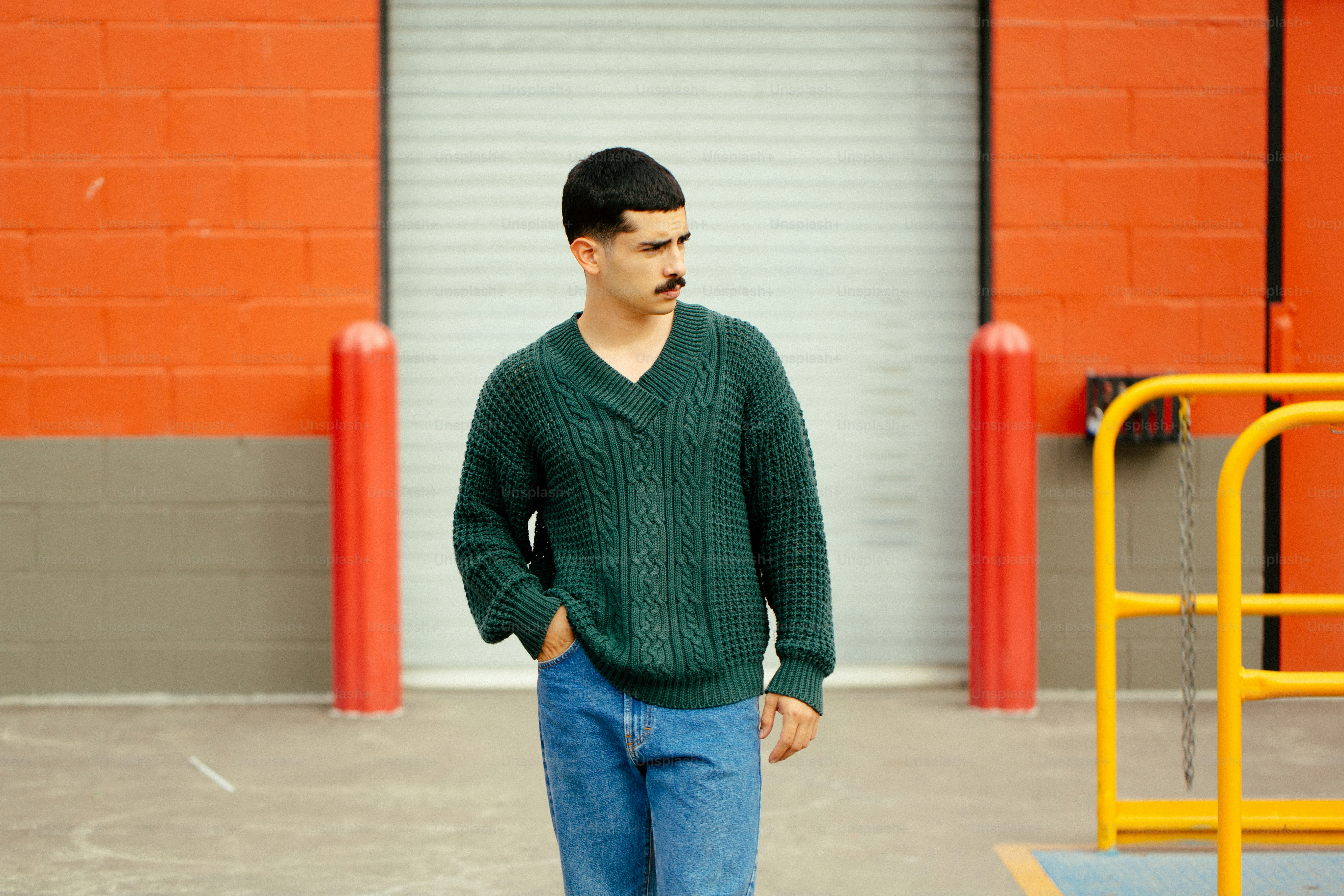 A man standing in front of a white wall photo – Mens fashion Image on ...