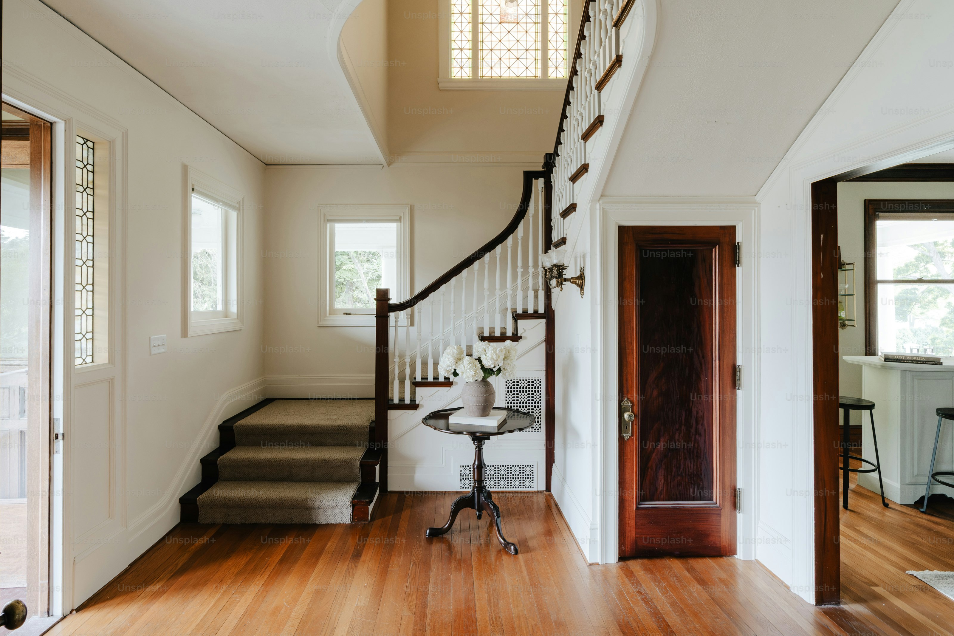 A staircase leading to a second floor of a house